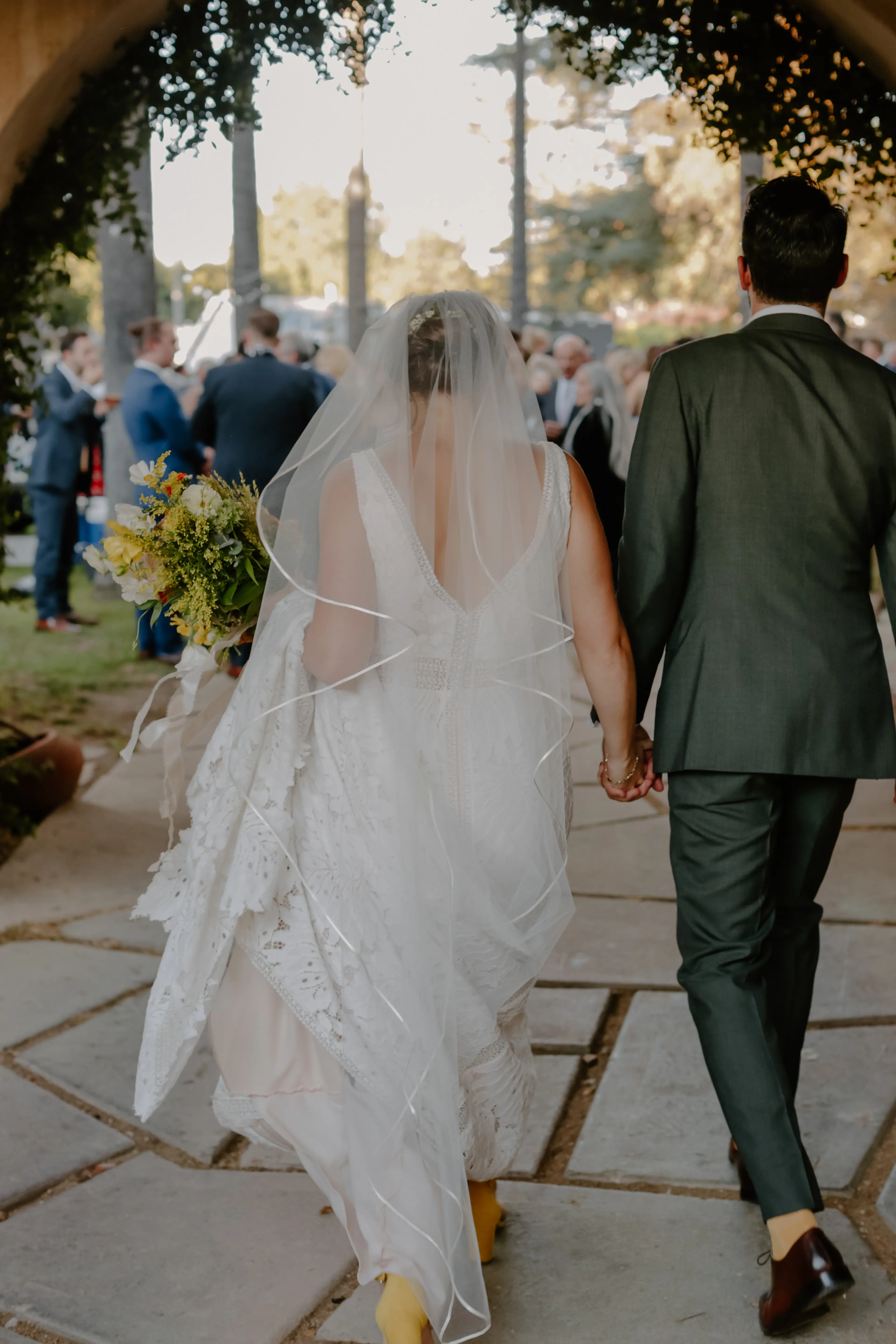 Bride wearing sexy boho lace wedding dress.