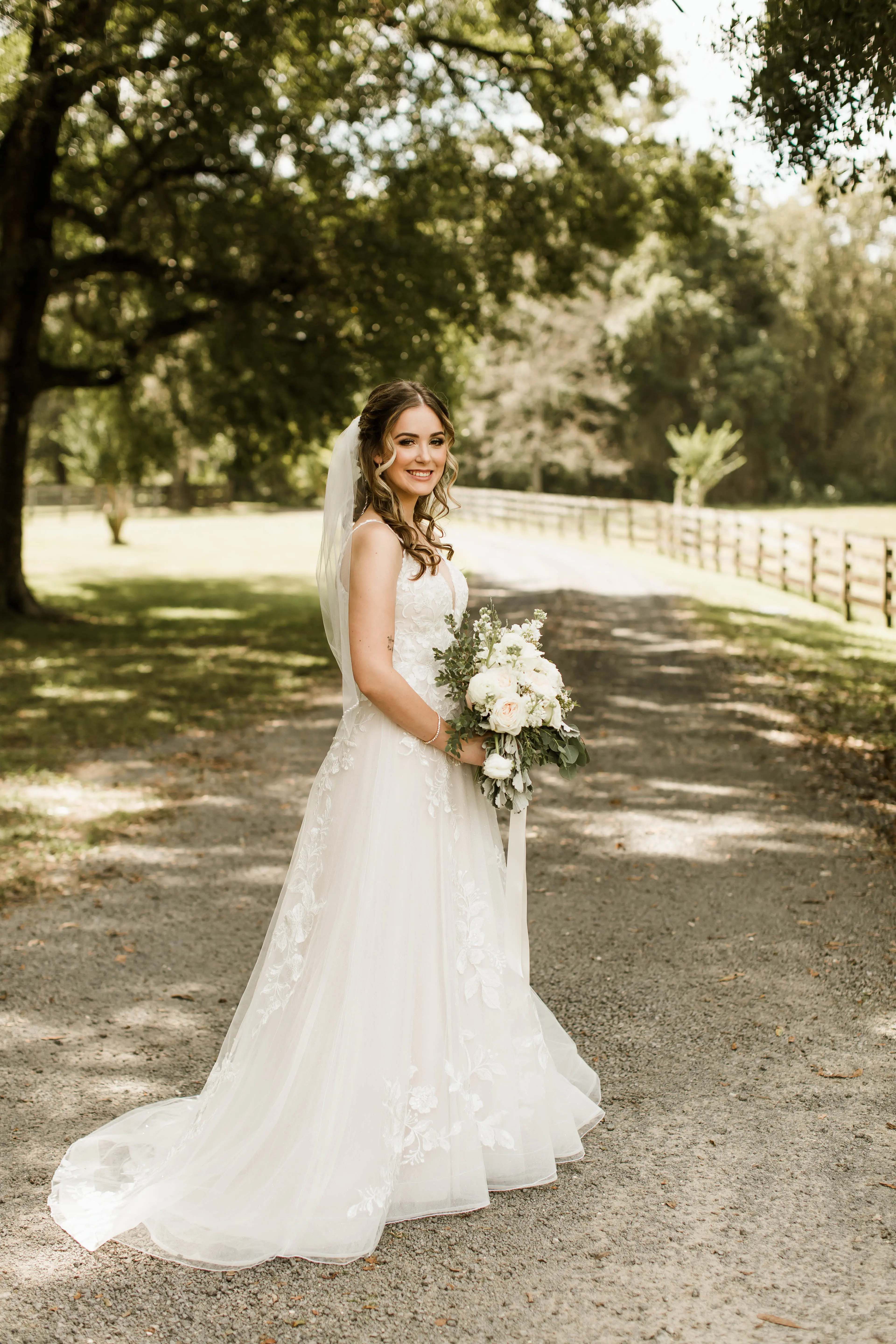 Bride wearing affordable floral ballgown wedding dress.