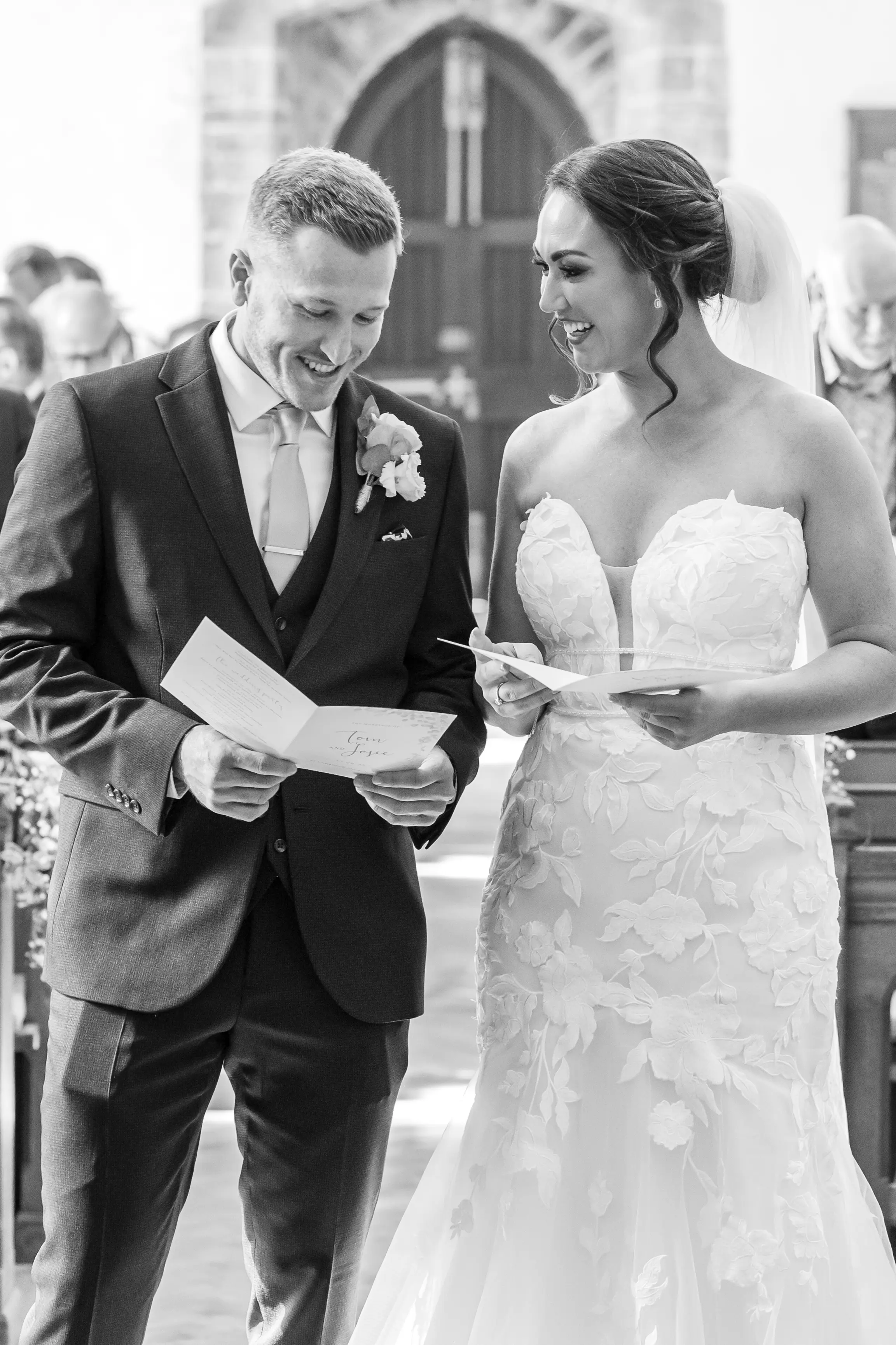 Bride Wearing Lace Mermaid Wedding Dress Called Hattie By Rebecca Ingram And Groom Exchanging Vows