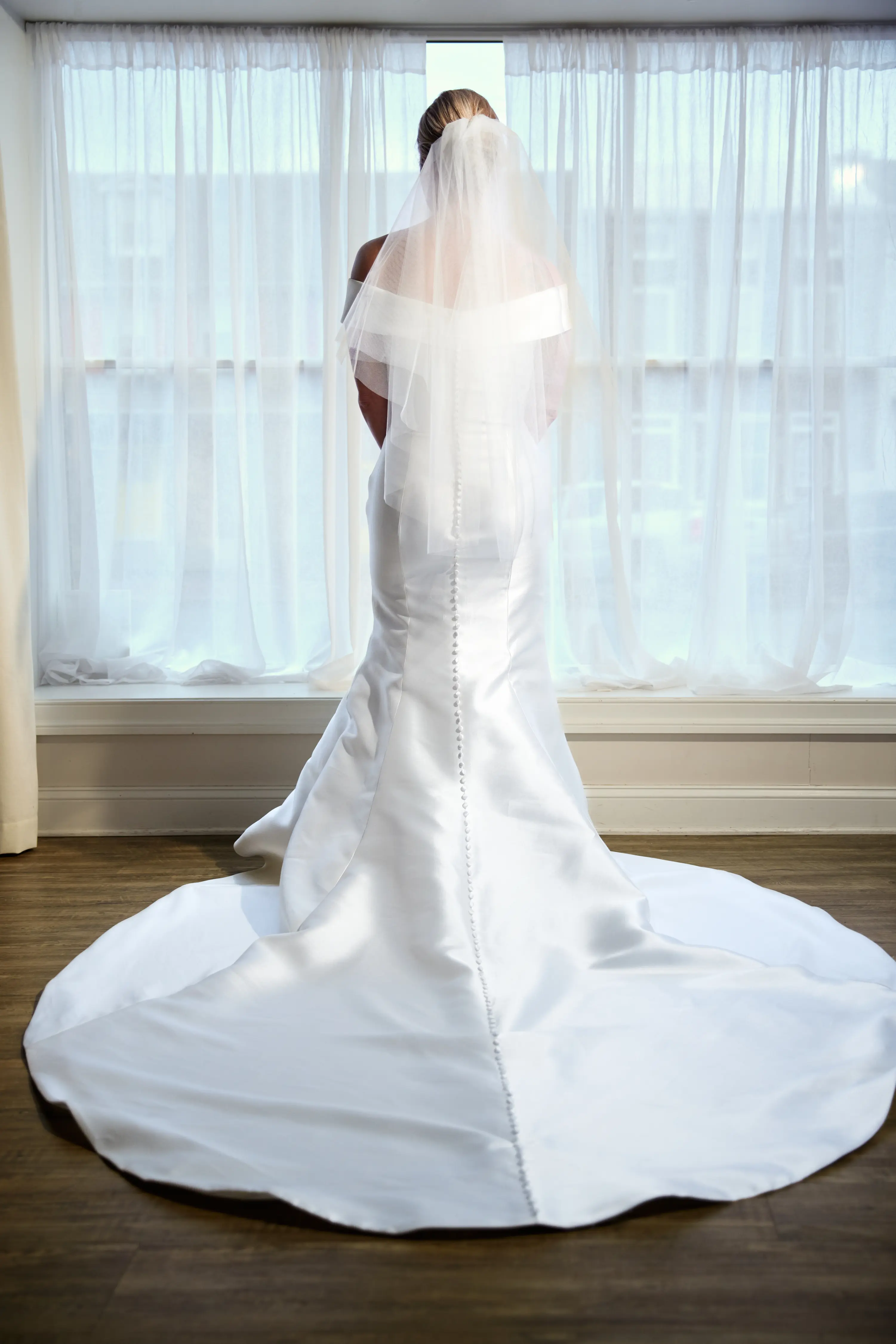Bride Showing Off Train of Wedding Dress Called Josie by Rebecca Ingram.