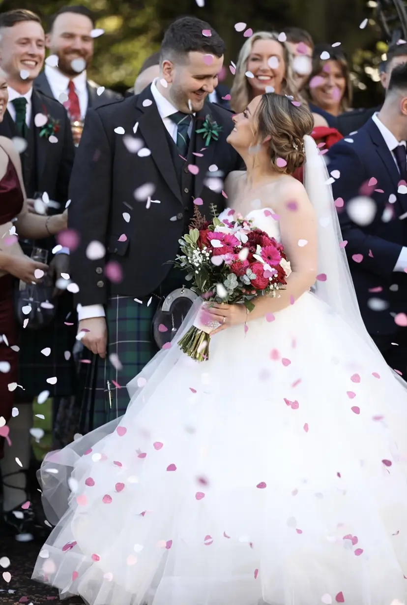 Groom With Bride Wearing Ball Gown With Tiered Skirt Yasmin By Maggie Sottero