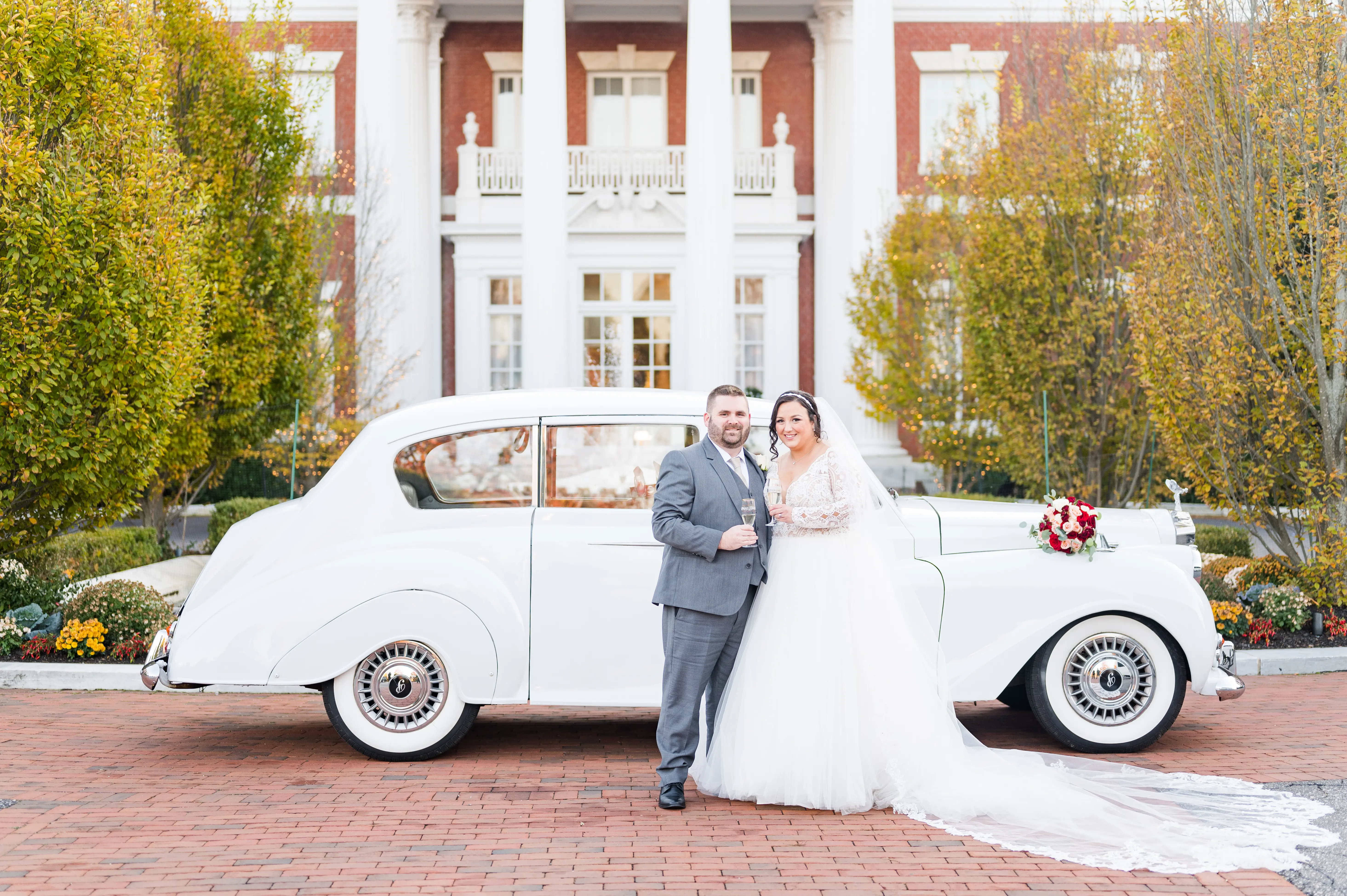 Bride And Groom Together. Bride Wearing Long Sleeve Lace Ball Gown With Tulle Skirt Called Mallory Dawn By Maggie Sottero