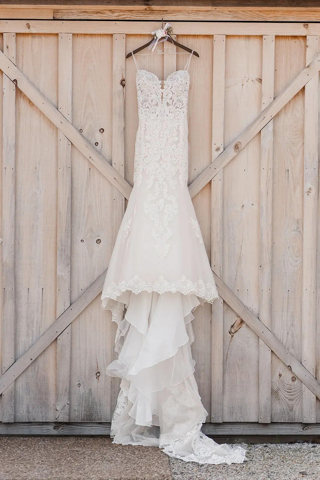 Sexy Mermaid Lace Wedding Dress Called Fiona By Maggie Sottero Hanging From Barn Door