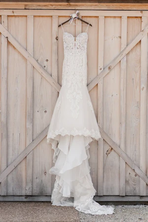 Sexy Mermaid Lace Wedding Dress Called Fiona By Maggie Sottero Hanging From Barn Door