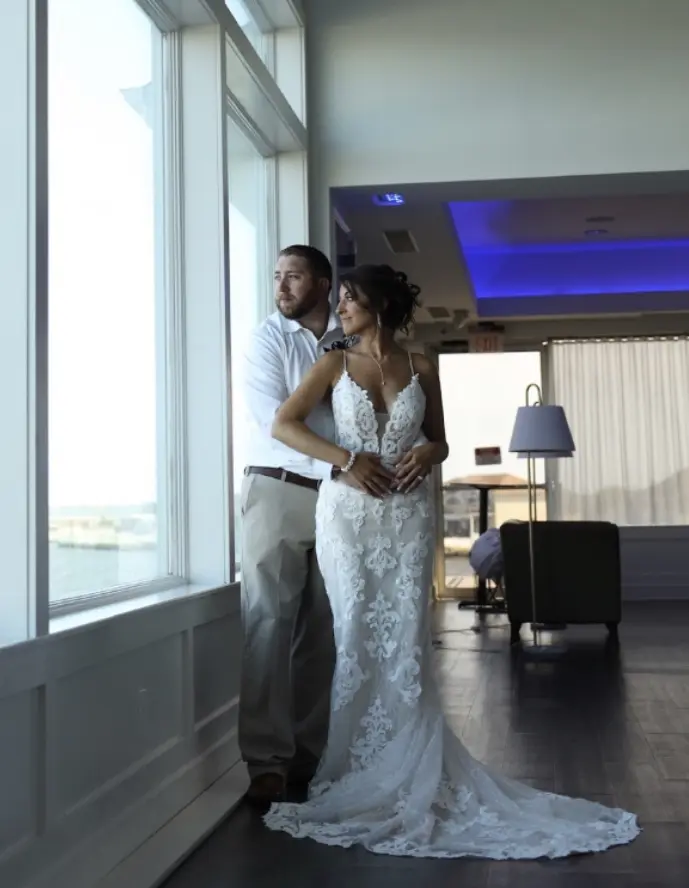 Groom With Bride Wearing Lace Sheath Wedding Dress Tuscany Lynette By Maggie Sottero