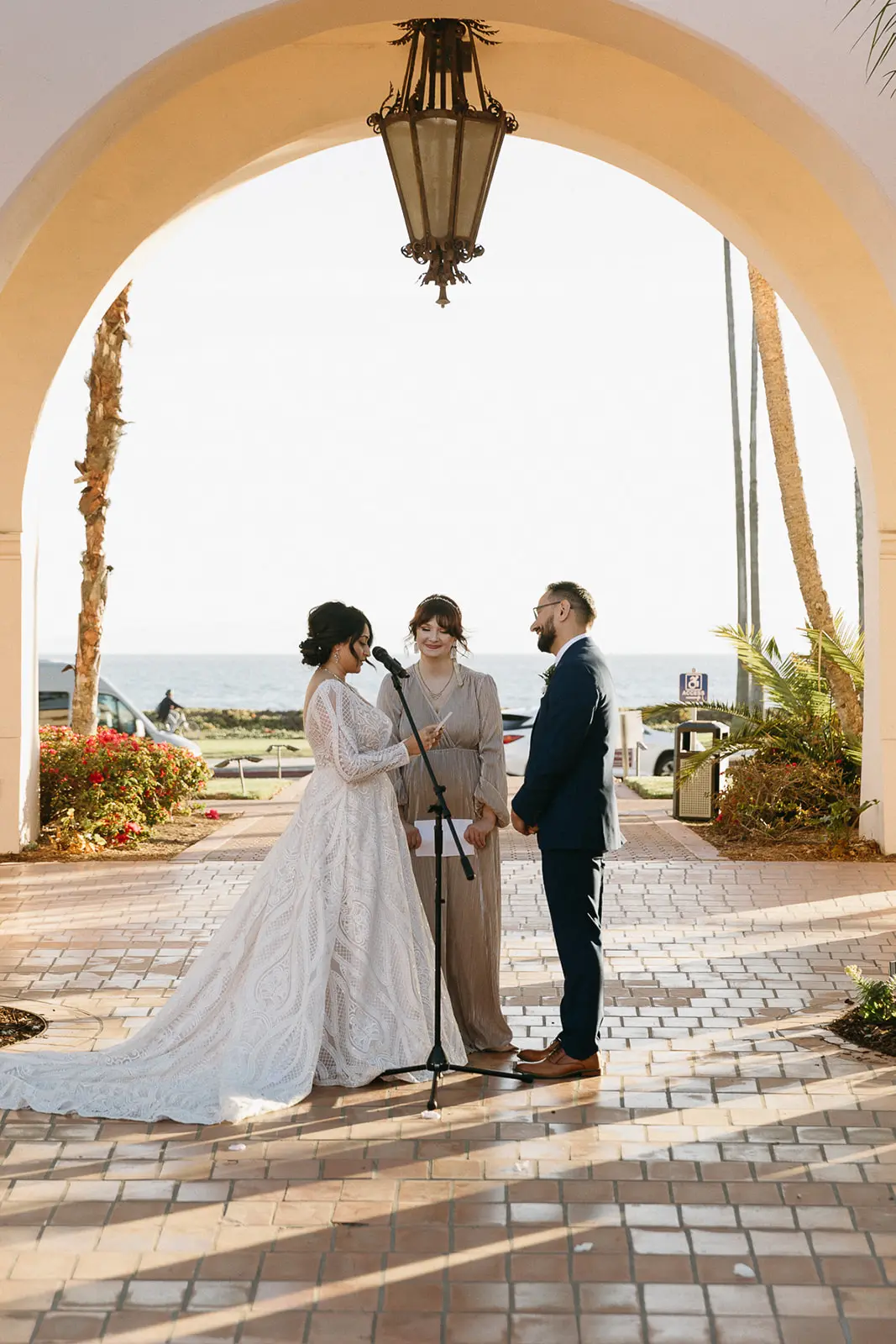Bride Wearing Boho Lace Wedding Dress Called Roxanne By Sottero And Midgley And Groom Exchanging Vows