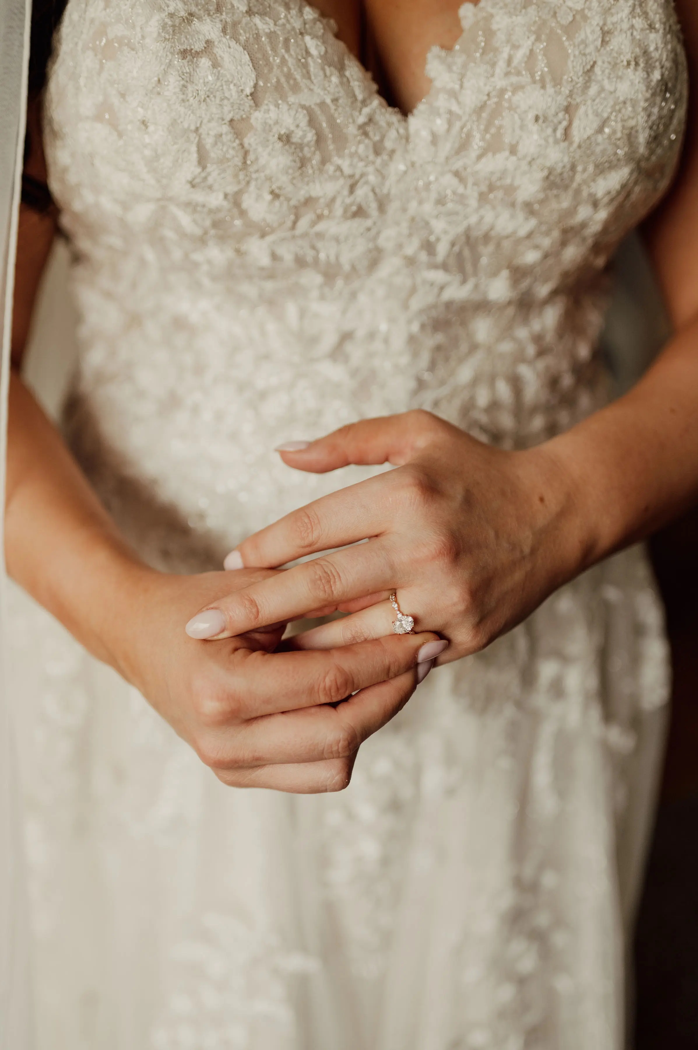 Bride Wearing Floral Lace Wedding Gown Called Laramie By Sottero And Midgley Close Up Detail Of Wedding Ring