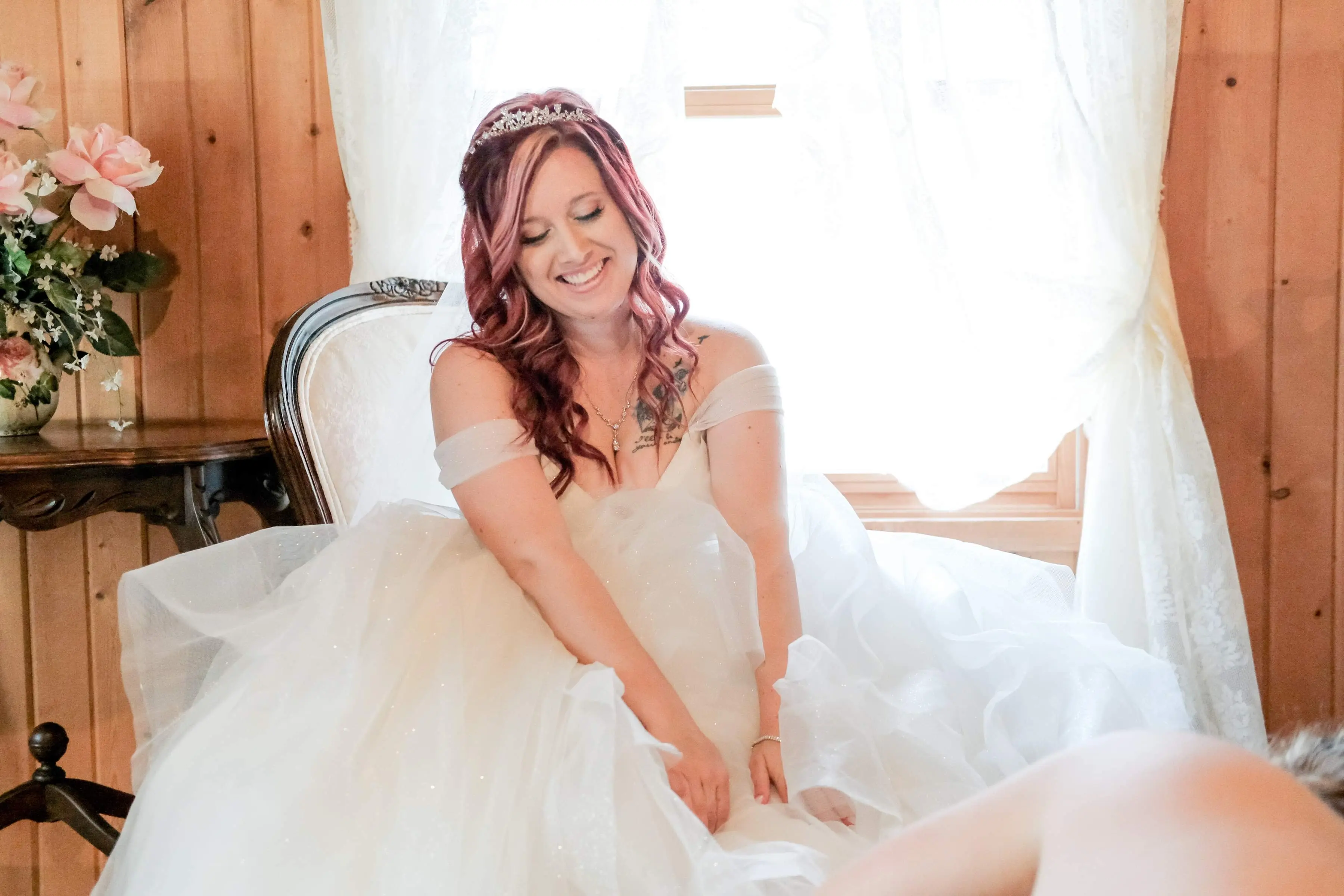 Bride Wearing Sparkly Princess Ballgown Wedding Dress Called Yasmin By Maggie Sottero Putting On Her Shoes