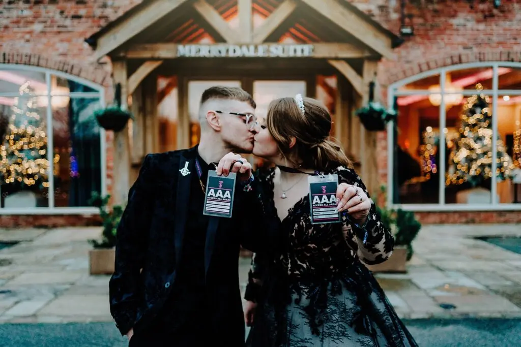 Bride Wearing Gothic Black Wedding Dress Called Zander By Maggie Sottero Kissing The Groom