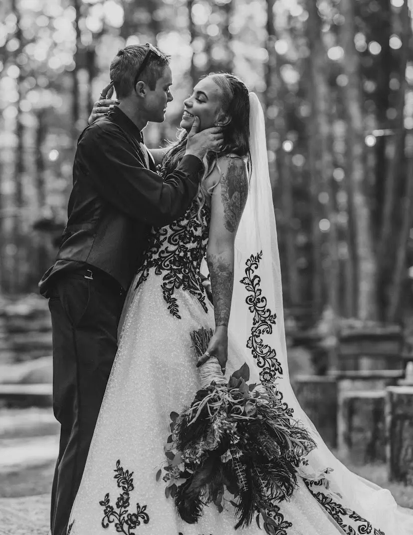 Groom With Bride Wearing Ball Gown With Black Lace Tristyn By Maggie Sottero