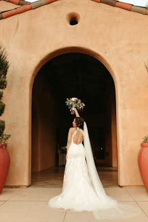 Bride wearing backless wedding dress called Elizabetta.