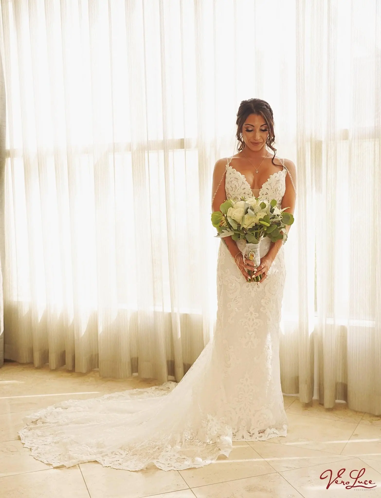 Bride with Bouquet wearing Sexy Boho Mermaid Wedding Dress called Tuscany by Maggie Sottero.
