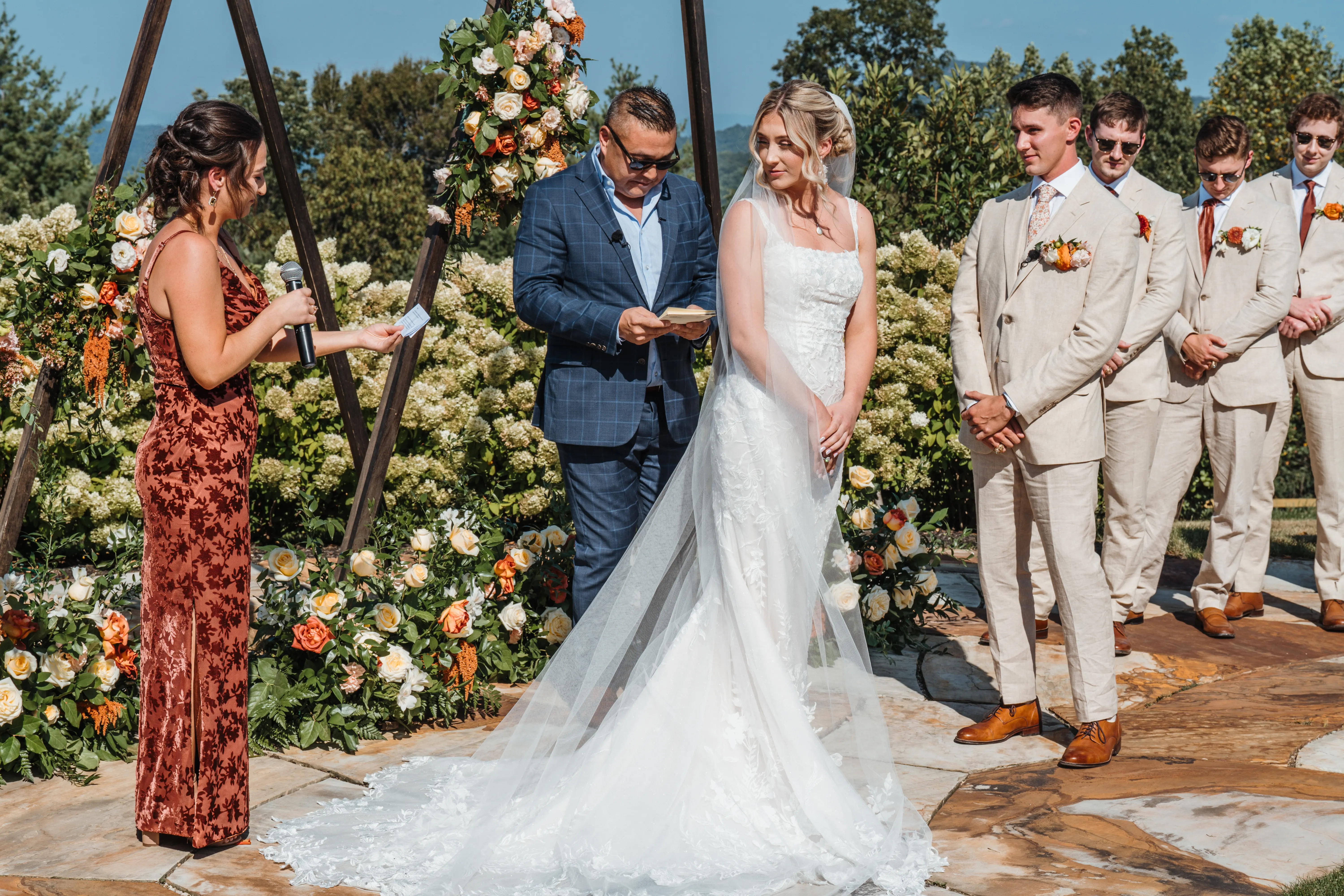 Bride wearing Albany wedding dress by Maggie Sottero at her ceremony
