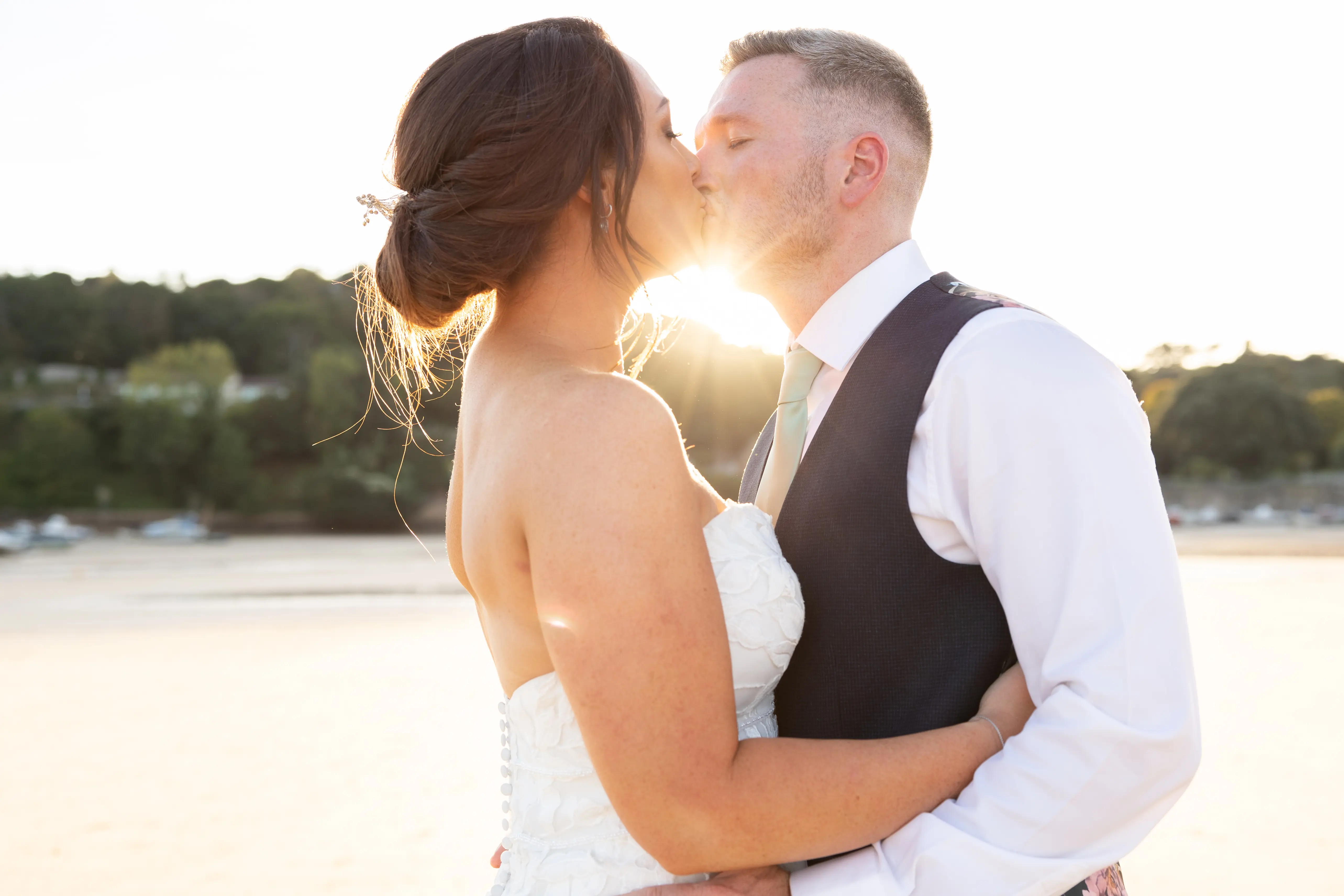 Bride Wearing Lace Mermaid Wedding Dress Called Hattie By Rebecca Ingram Kissing Groom