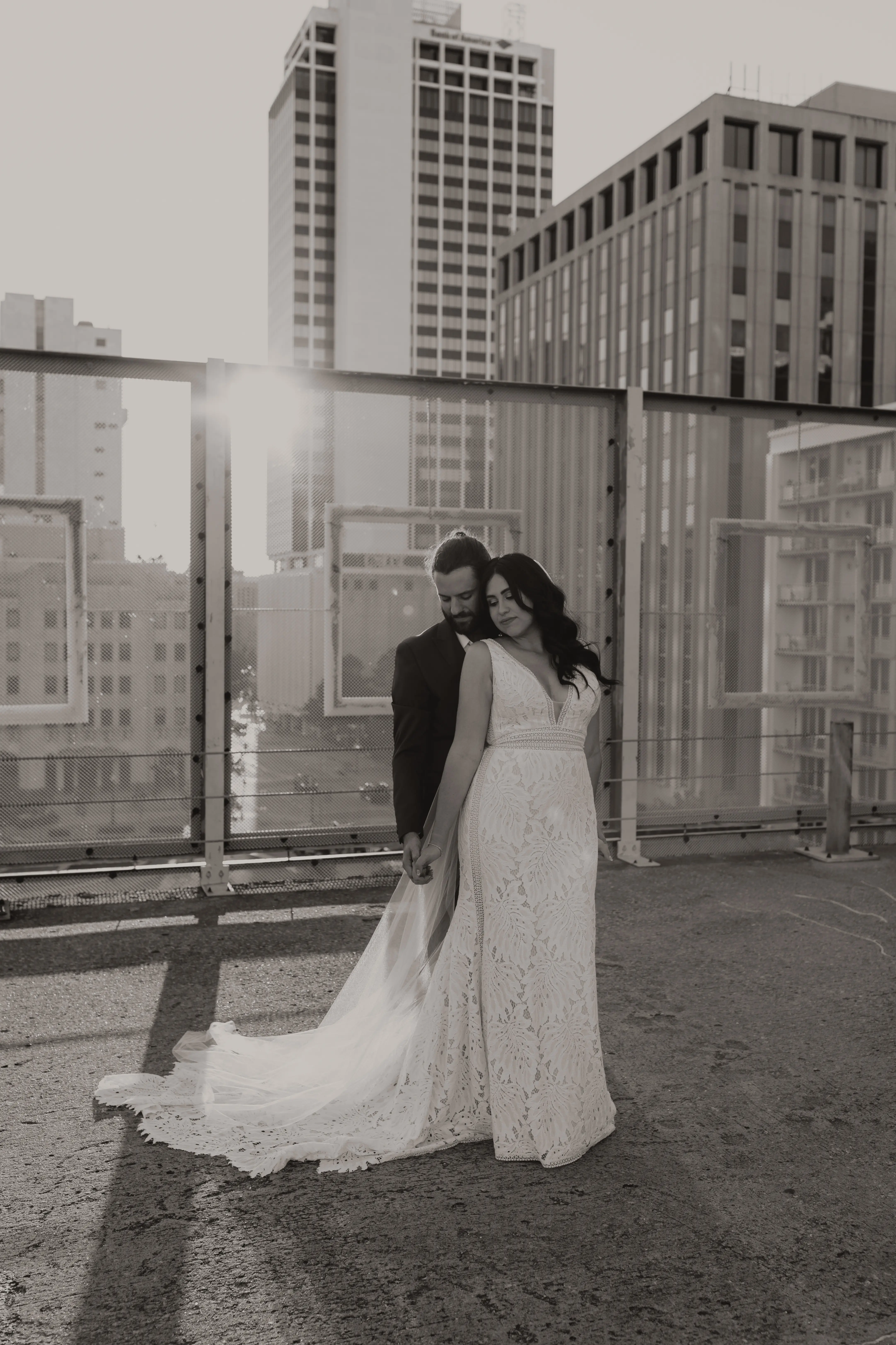 Bride leaning back on her groom.