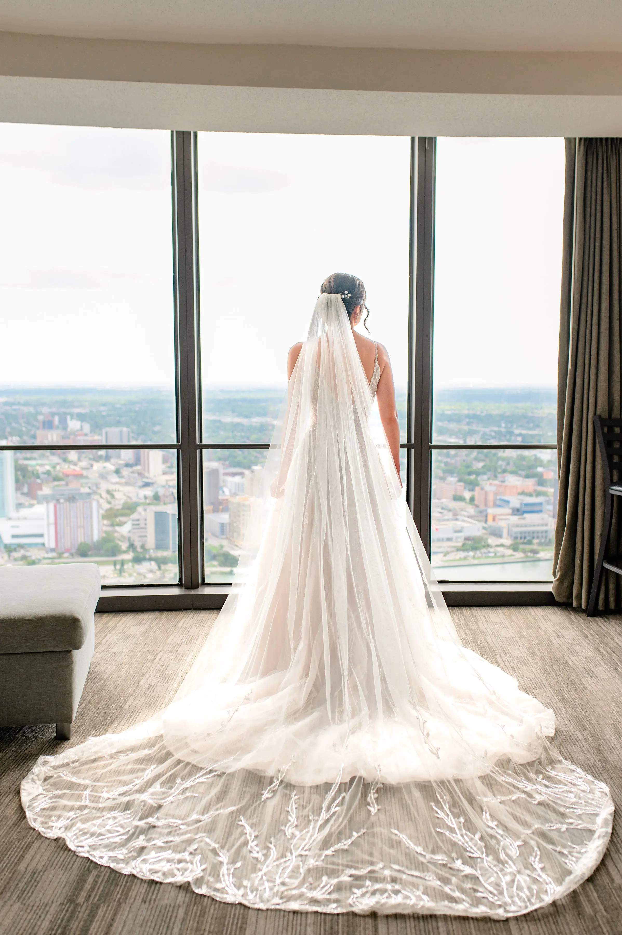 Bride wearing Marvine wedding gown by Sottero and Midgley