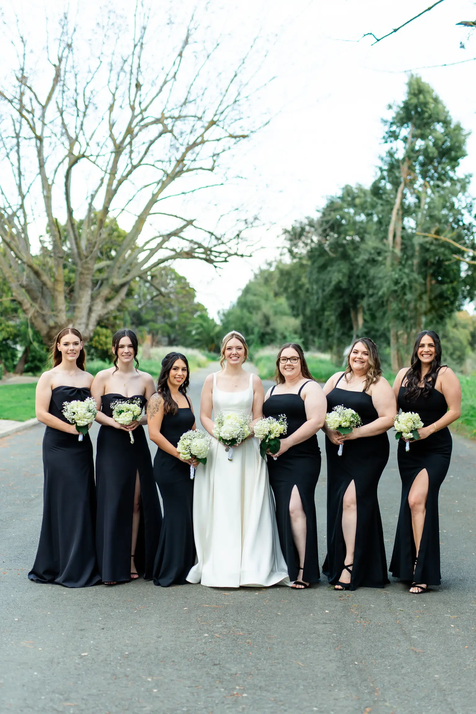 Bride wearing Selena by Maggie Sottero with her bridesmaids