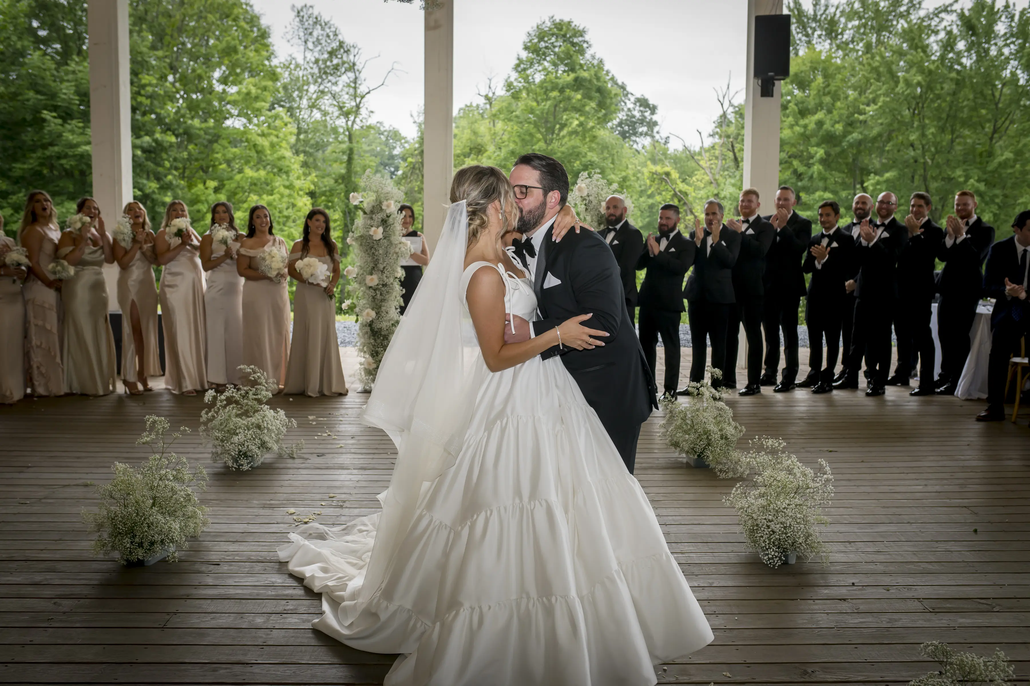 Bride wearing Talitha by Sottero and Midgley kissing her husband