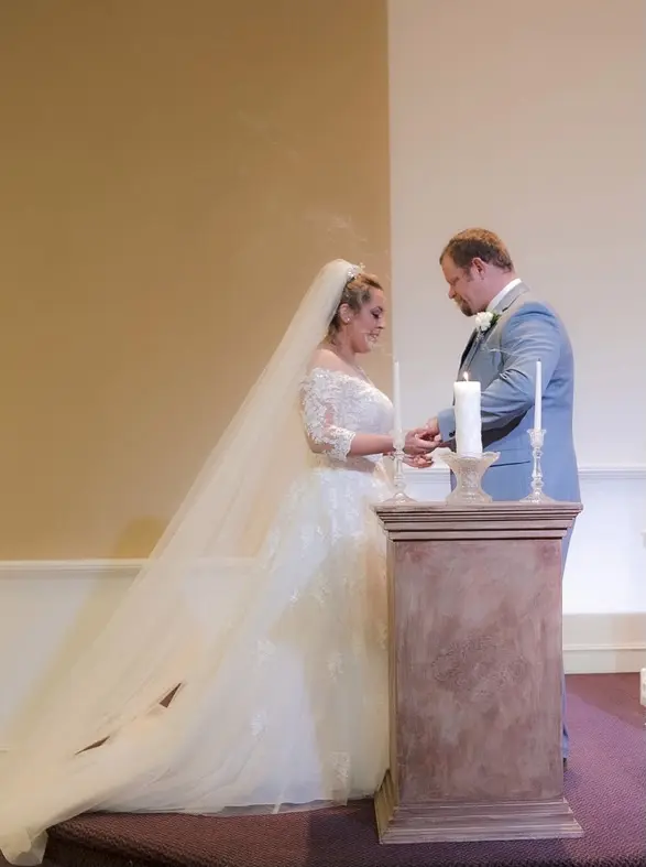 bride with groom wearing off the shoulder A line wedding dress