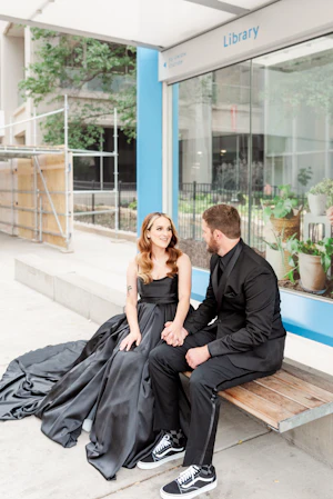 Bride wearing Scarlet wedding dress by Maggie Sottero while holding hands with her husband