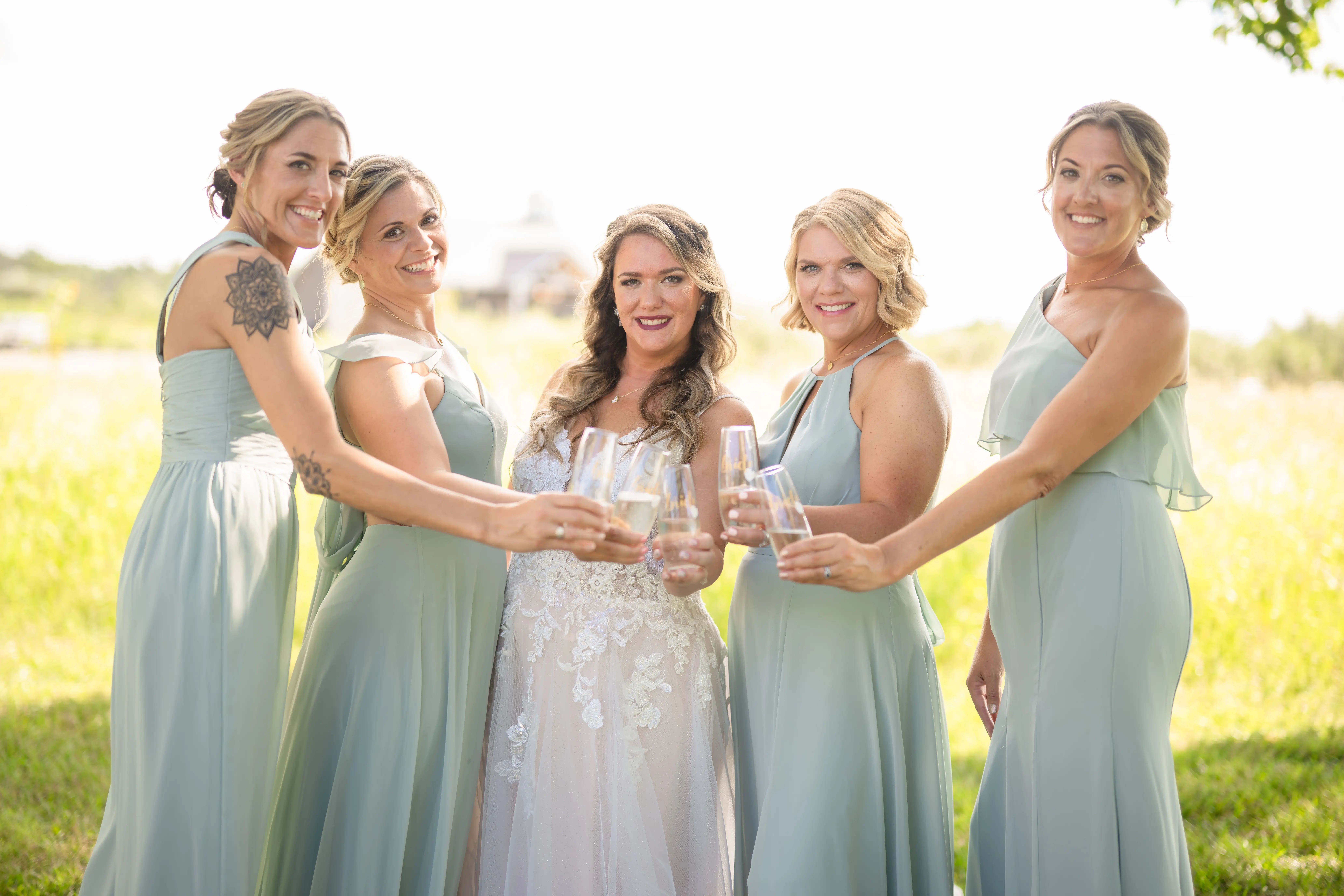Bride Wearing Lace Princess Wedding Dress Called Stevie By Maggie Sottero Drinking Champagne With Bridesmaids