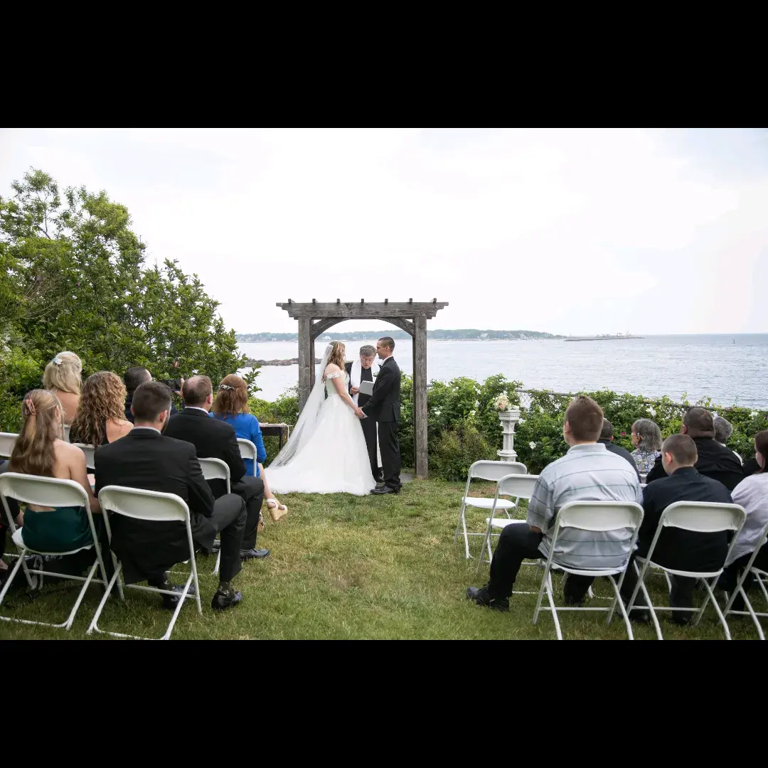 Bride wearing Harlem wedding dress by Maggie Sottero under the arch
