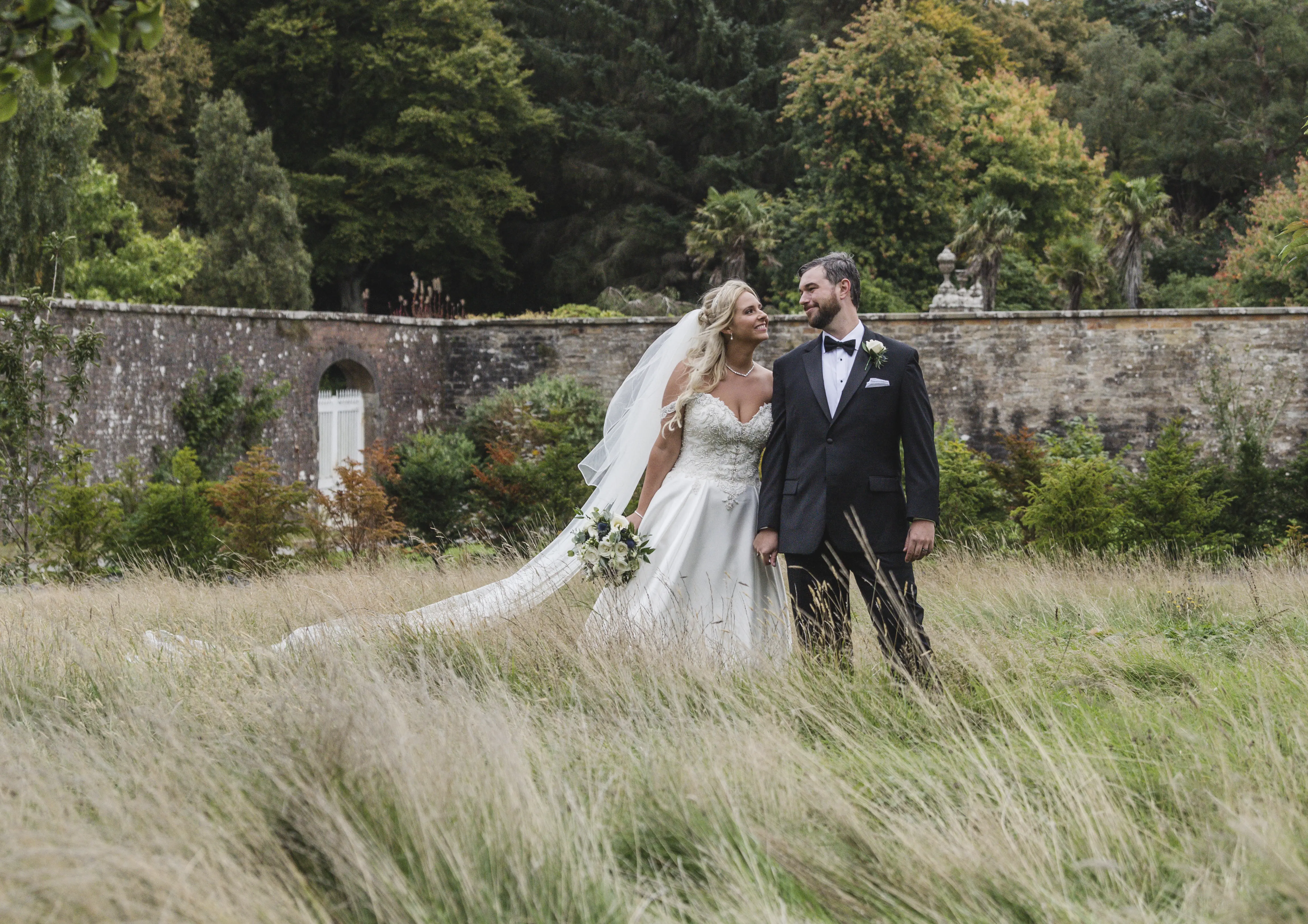 Bride In Satin Wedding Dress Called Kimora By Sottero And Midgley With Groom