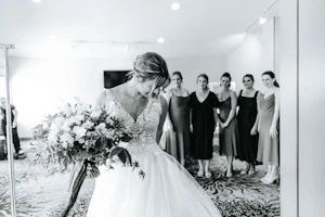 Bride Wearing V-Neck A-Line Wedding Dress Minerva By Rebecca Ingram