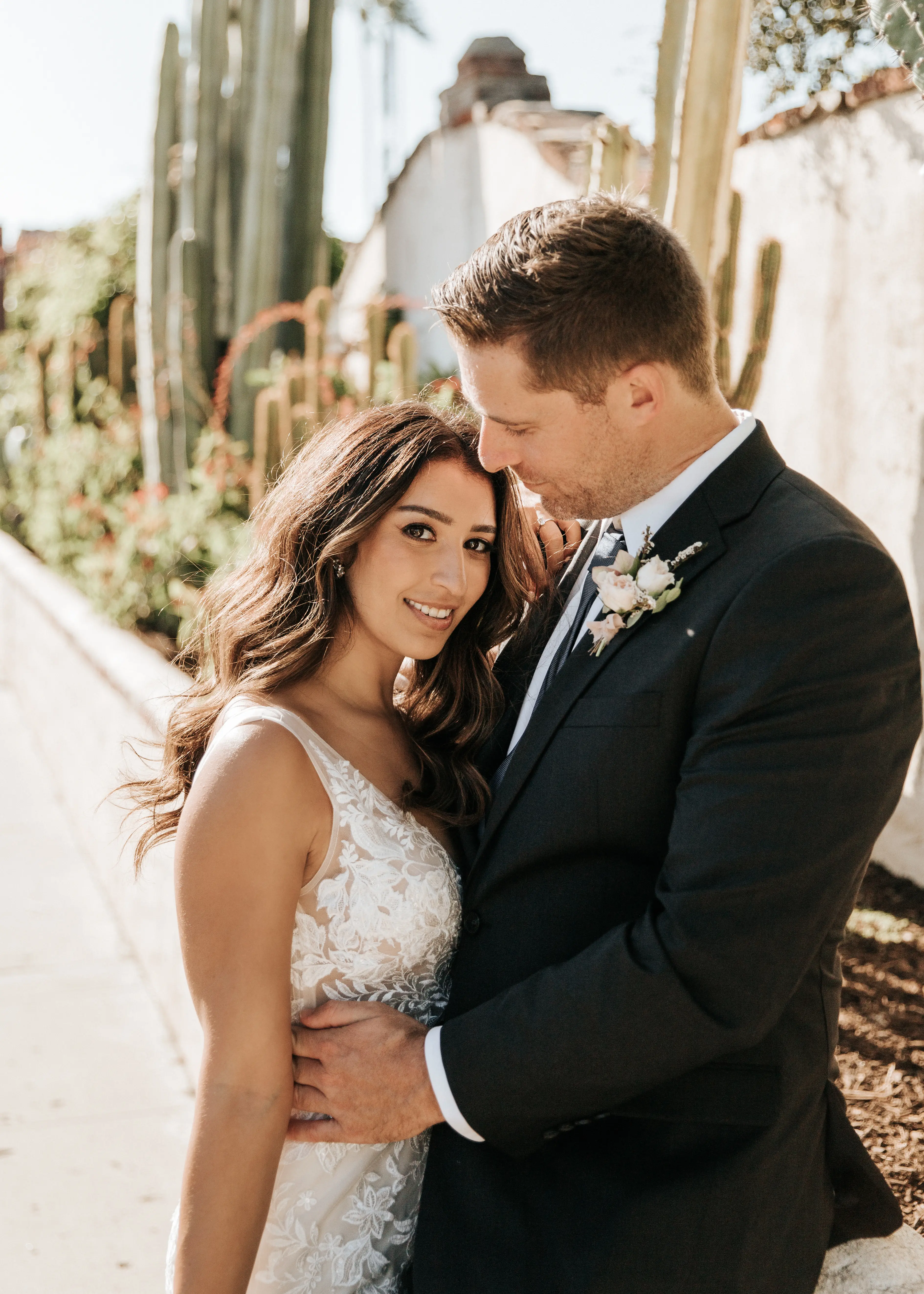Bride with groom wearing floral fit and flare wedding dress