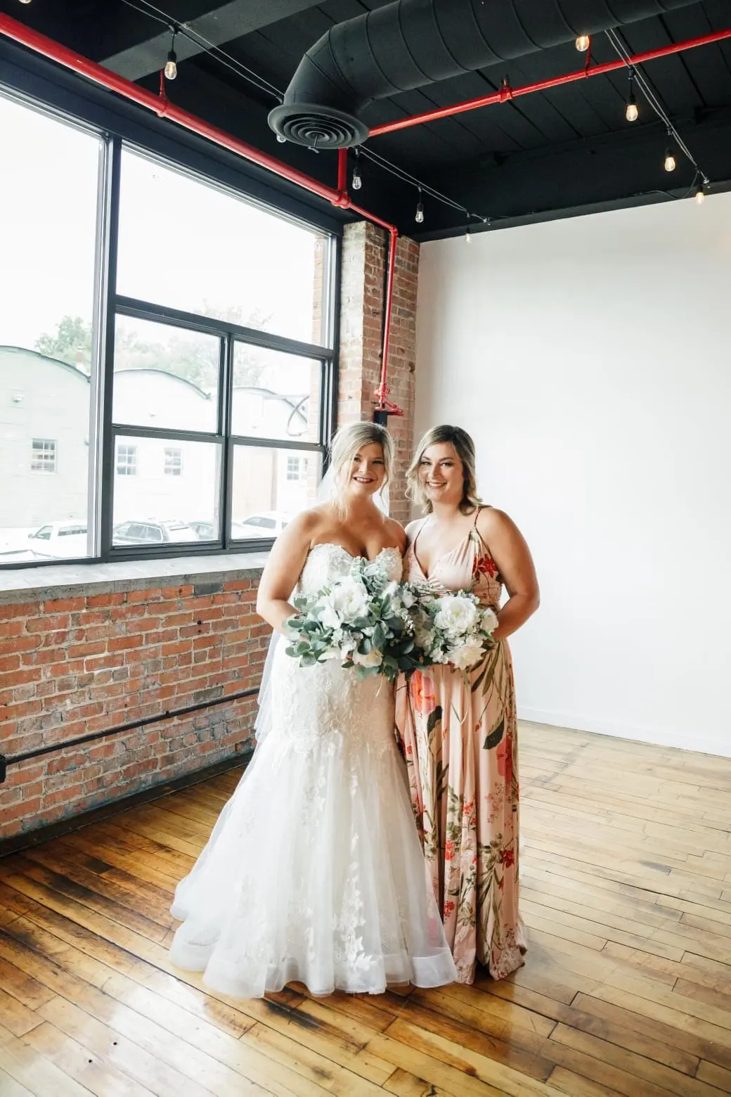 Bride wearing glamorous plus size mermaid wedding dress