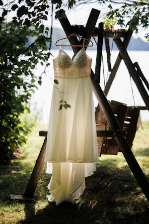 Beaded Wedding Dress With Flowy Skirt Called Lorraine By Rebecca Ingram On A Hanger