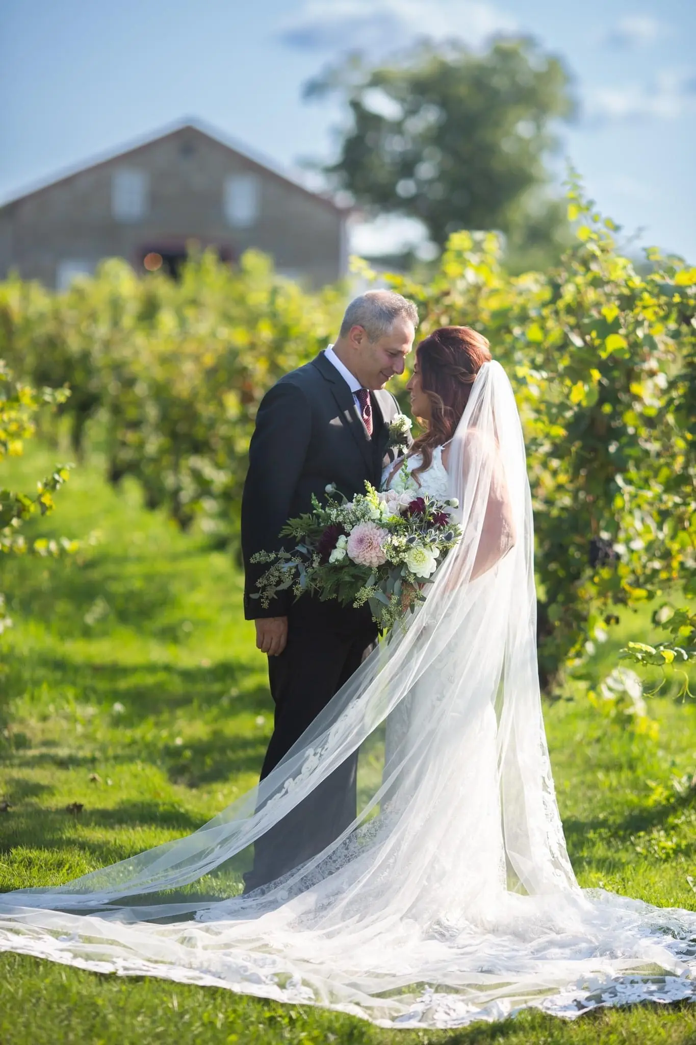 Bride Wearing Sexy Mermaid Wedding Dress Called Tuscany By Maggie Sottero With Groom In Vineyard Long Veil