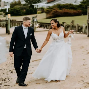 Groom and Bride at a Beach Wedding Wearing Lace Aline Wedding Dress called Savannah by Maggie Sottero