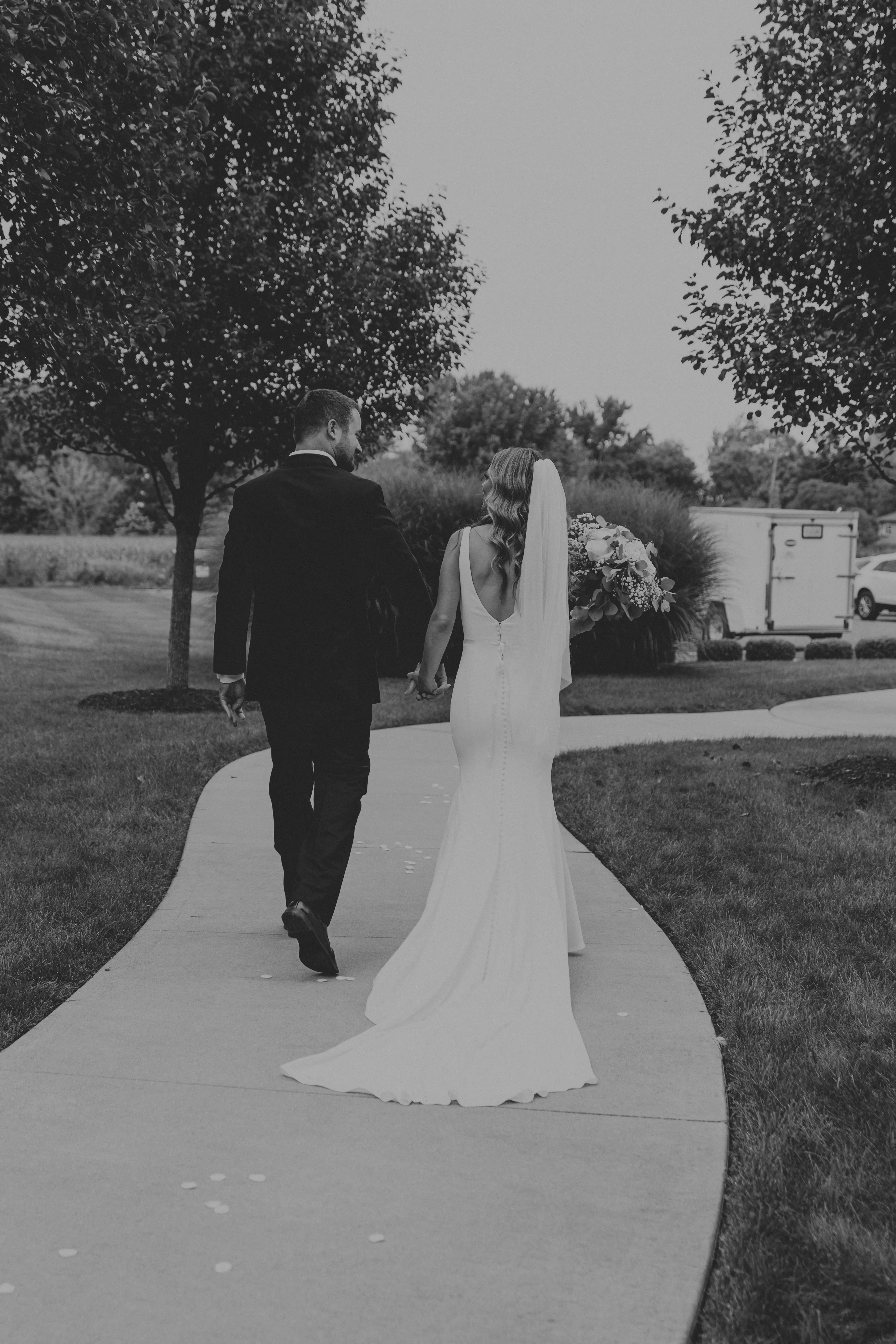 Bride Wearing Simple Fit-and-Flare Wedding Dress Called Fernanda By Maggie Sottero With Groom