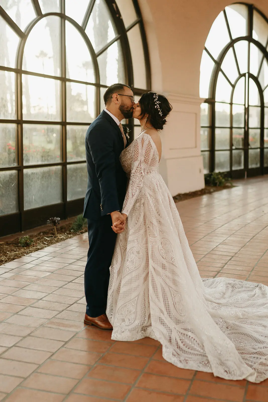 Bride Wearing Lace A-Line Wedding Dress Called Roxanne By Sottero And Midgley With Groom