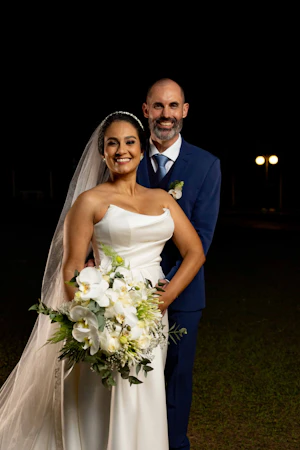 Bride wearing Aspen wedding dress by Sottero and Midgley with her husband