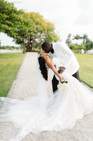 Real Bride in Strapless Mermaid Bridal Gown in Oversized Lace with Floral Lace Motifs over Sparkle Tulle and Sweetheart Neckline called Hattie by Rebecca Ingram