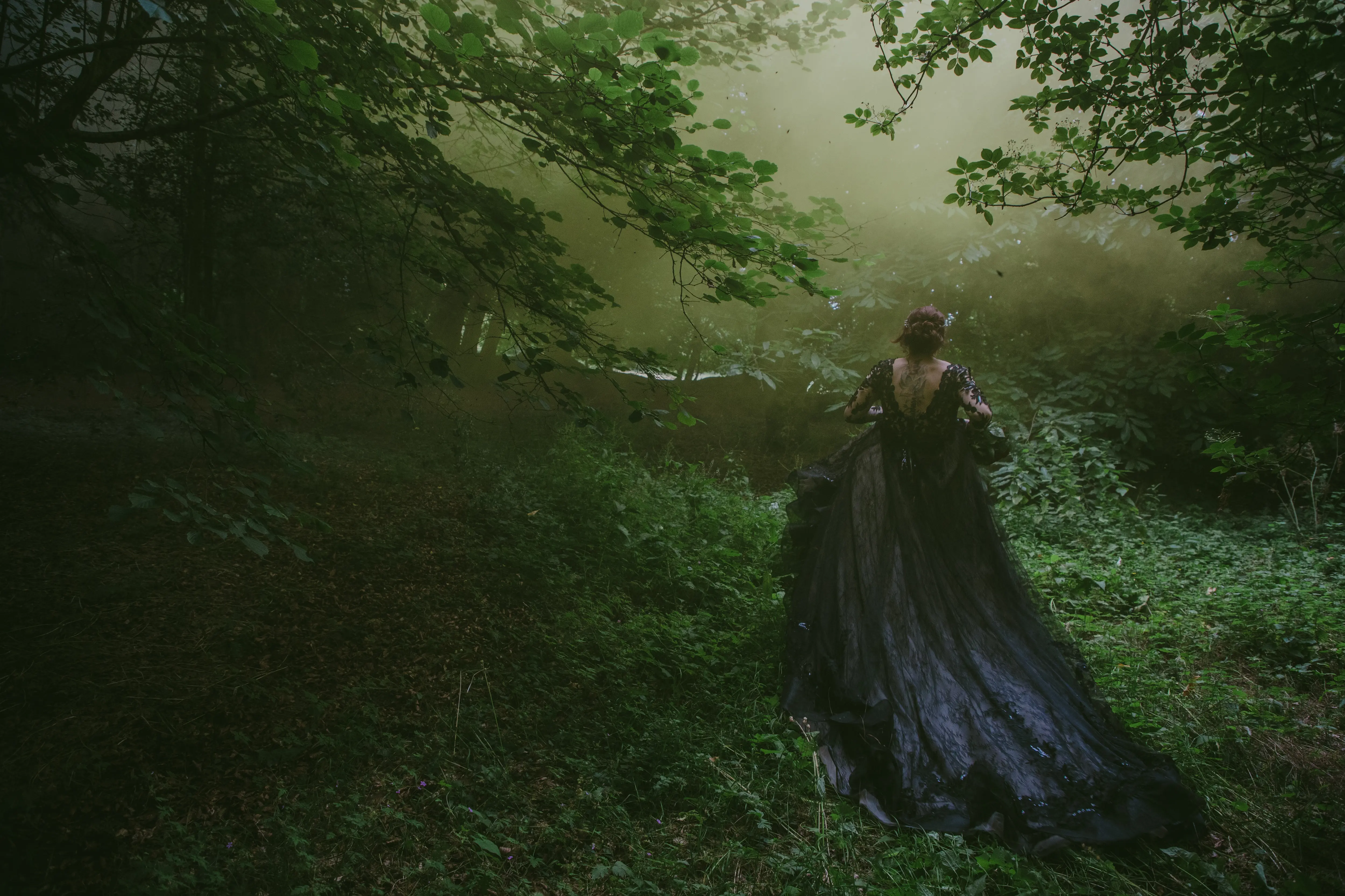 Bride wearing Zander wedding dress by Sottero and Midgley in the woods