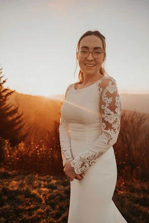 Bride Wearing Simple Long Sleeve Wedding Dress Called Bethany By Rebecca Ingram