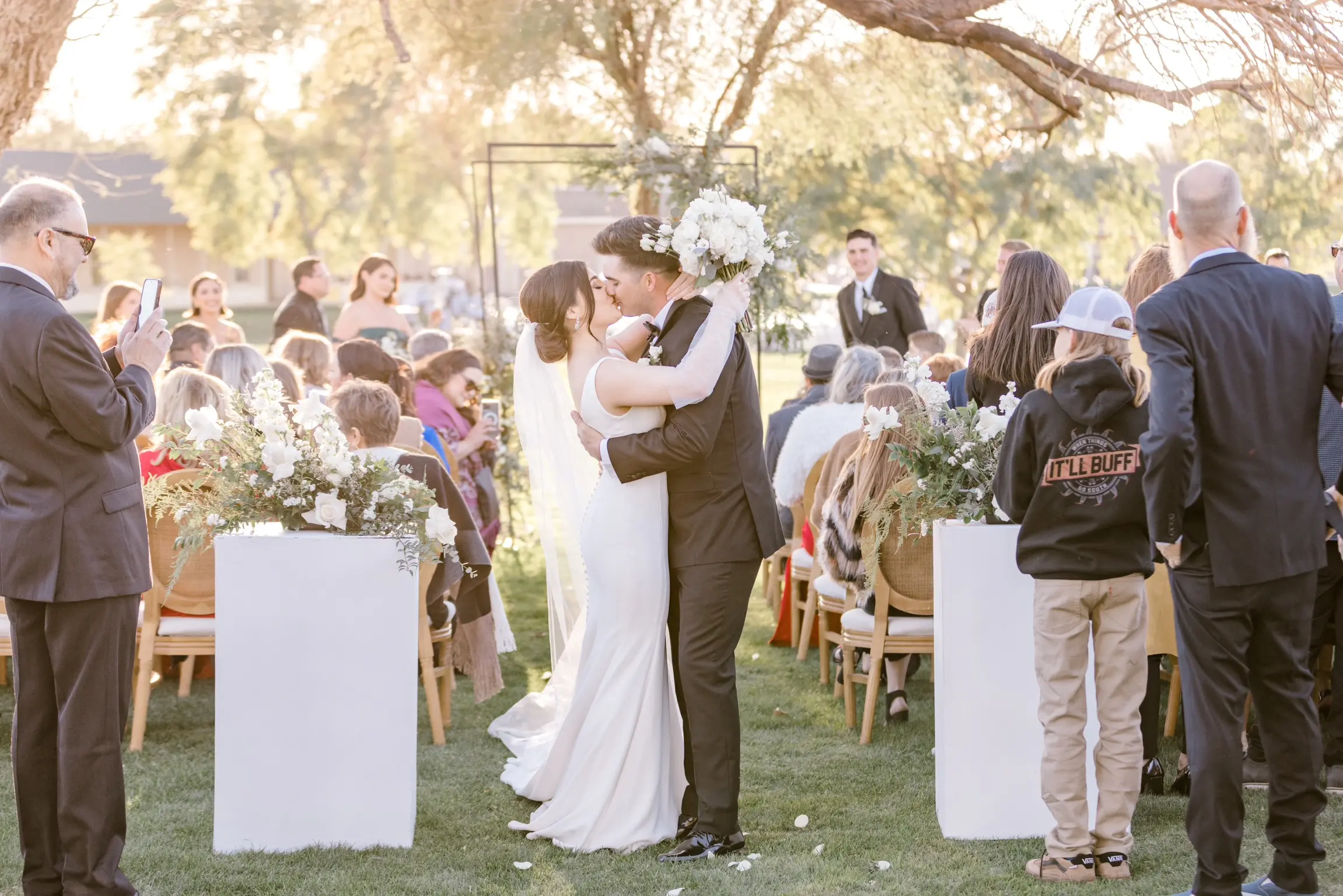 Bride In Simple Crepe Wedding Dress Called Fernanda By Maggie Sottero With Groom At Ceremony