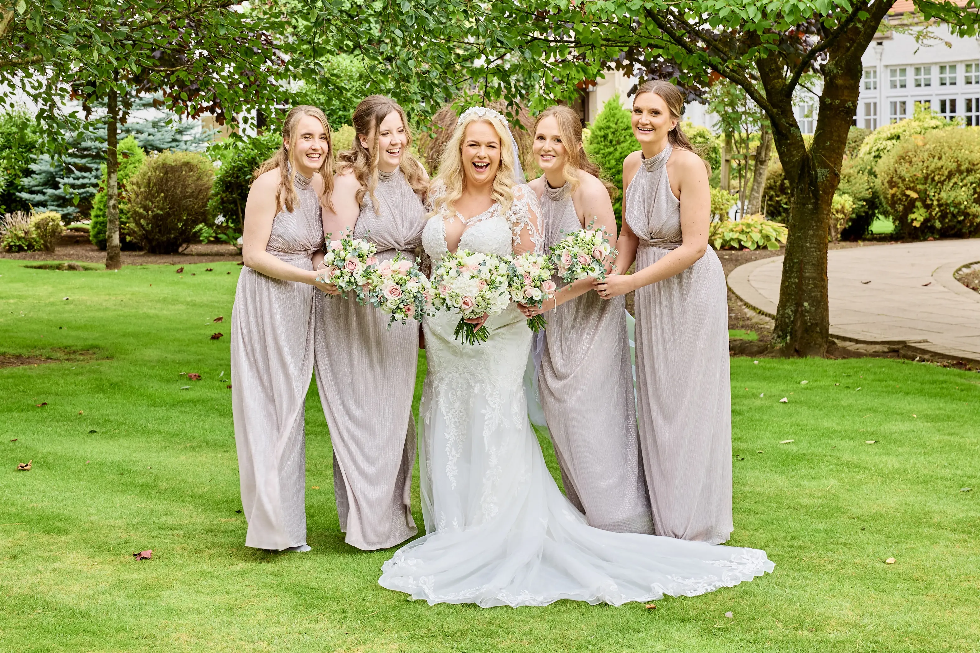 Bride wearing Saige by Maggie Sottero with her bridesmaids