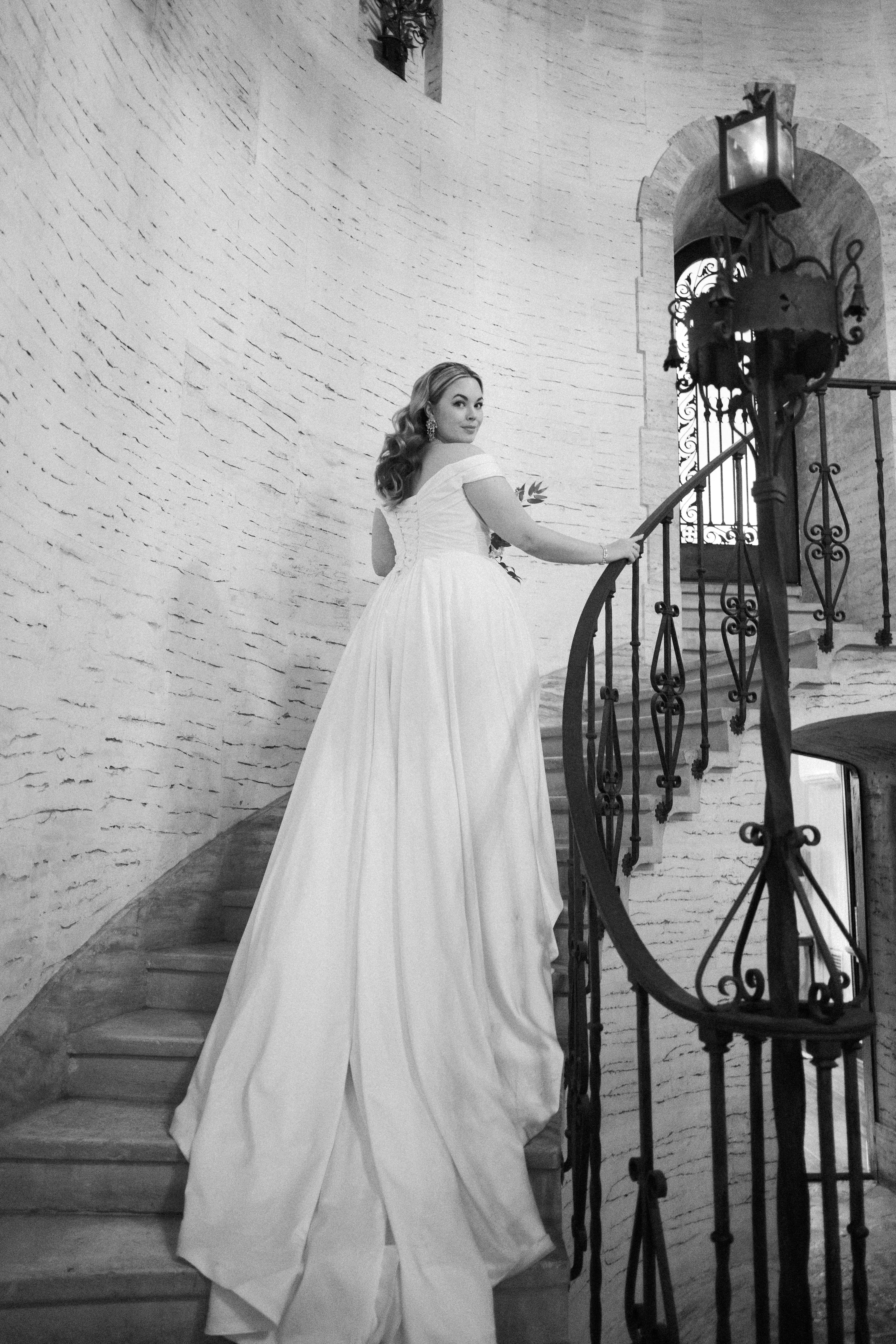 Bride wearing Ekaterina by Maggie Sottero walking up the stairs