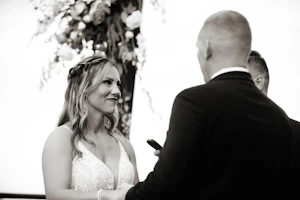 Groom with Bride in V-Neckline Wedding Gown Accented with Beaded Detail Called Bailey by Sottero & Midgley
