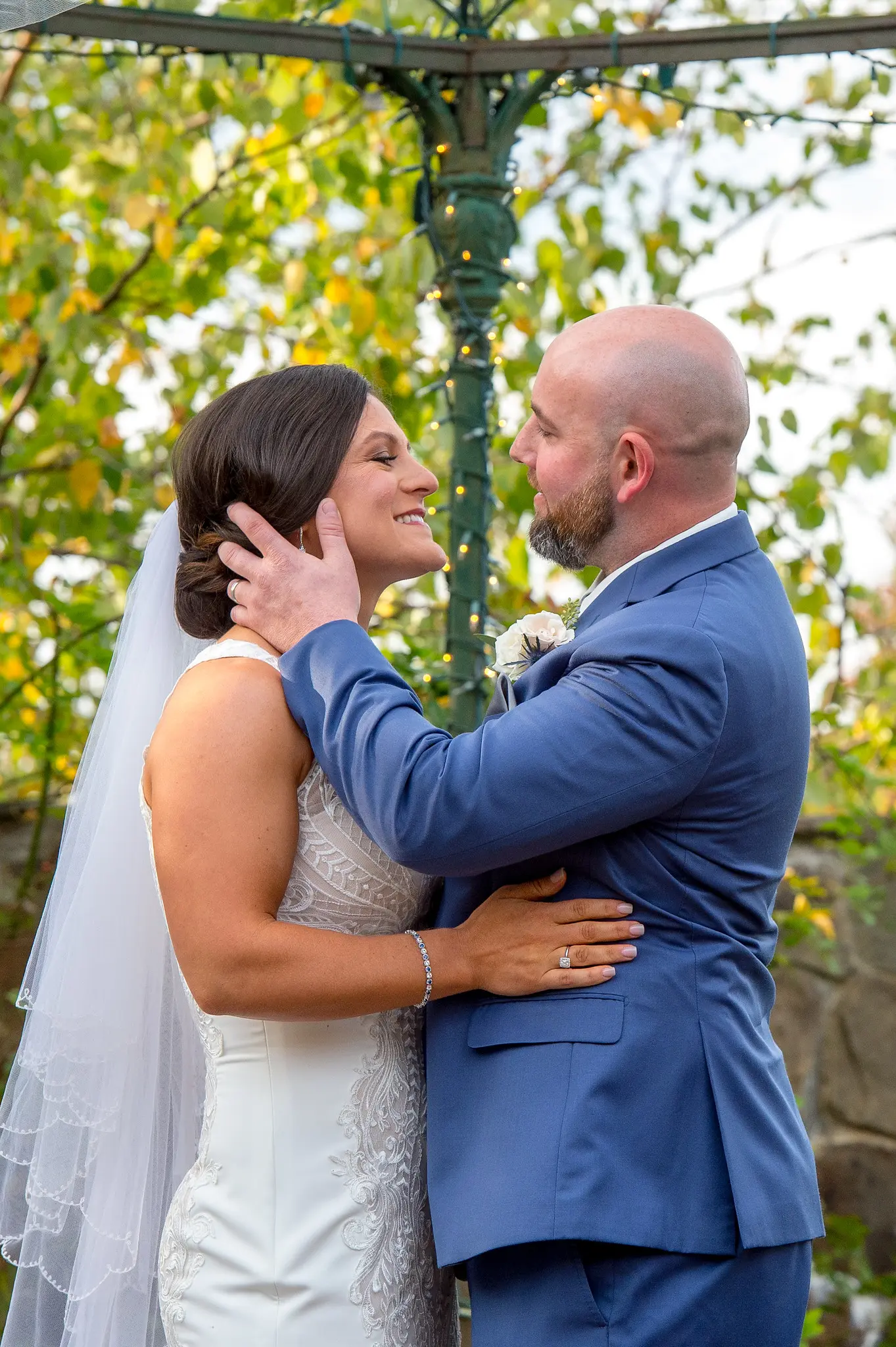 Bride wearing Lace Sheath Wedding Dress called Kevyn by Sottero and Midgley with groom