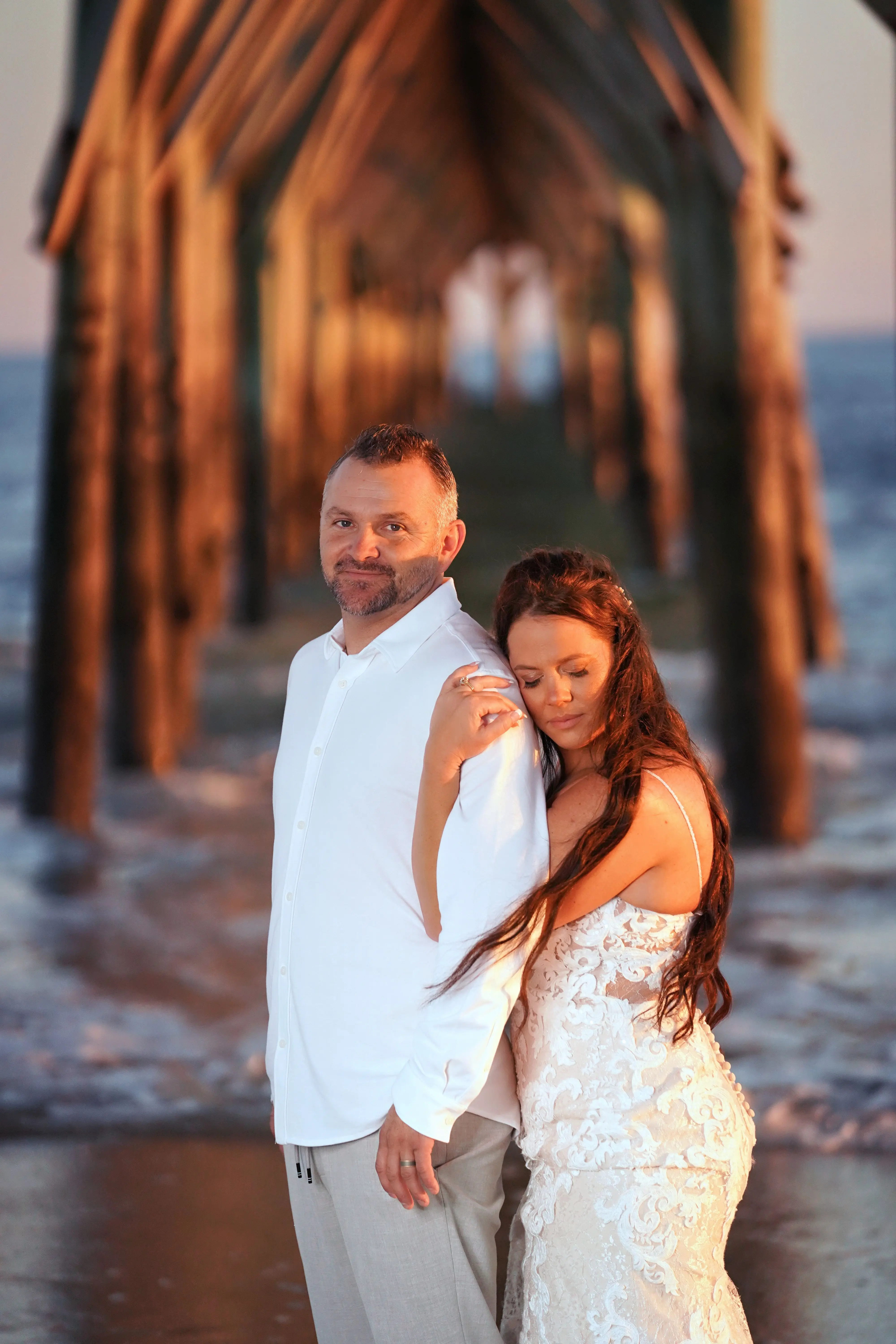 Groom With Bride Wearing Lace Sheath Wedding Gown Tuscany Lynette By Maggie Sottero