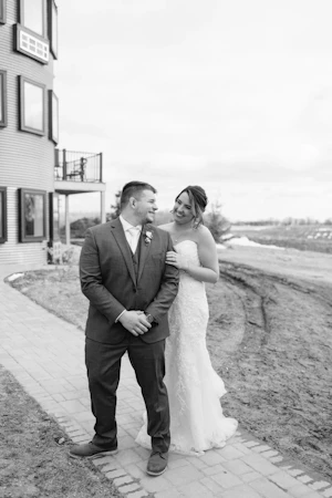 Bride Wearing Lace Beaded Wedding Dress Called Charmaine By Maggie Sottero With Groom