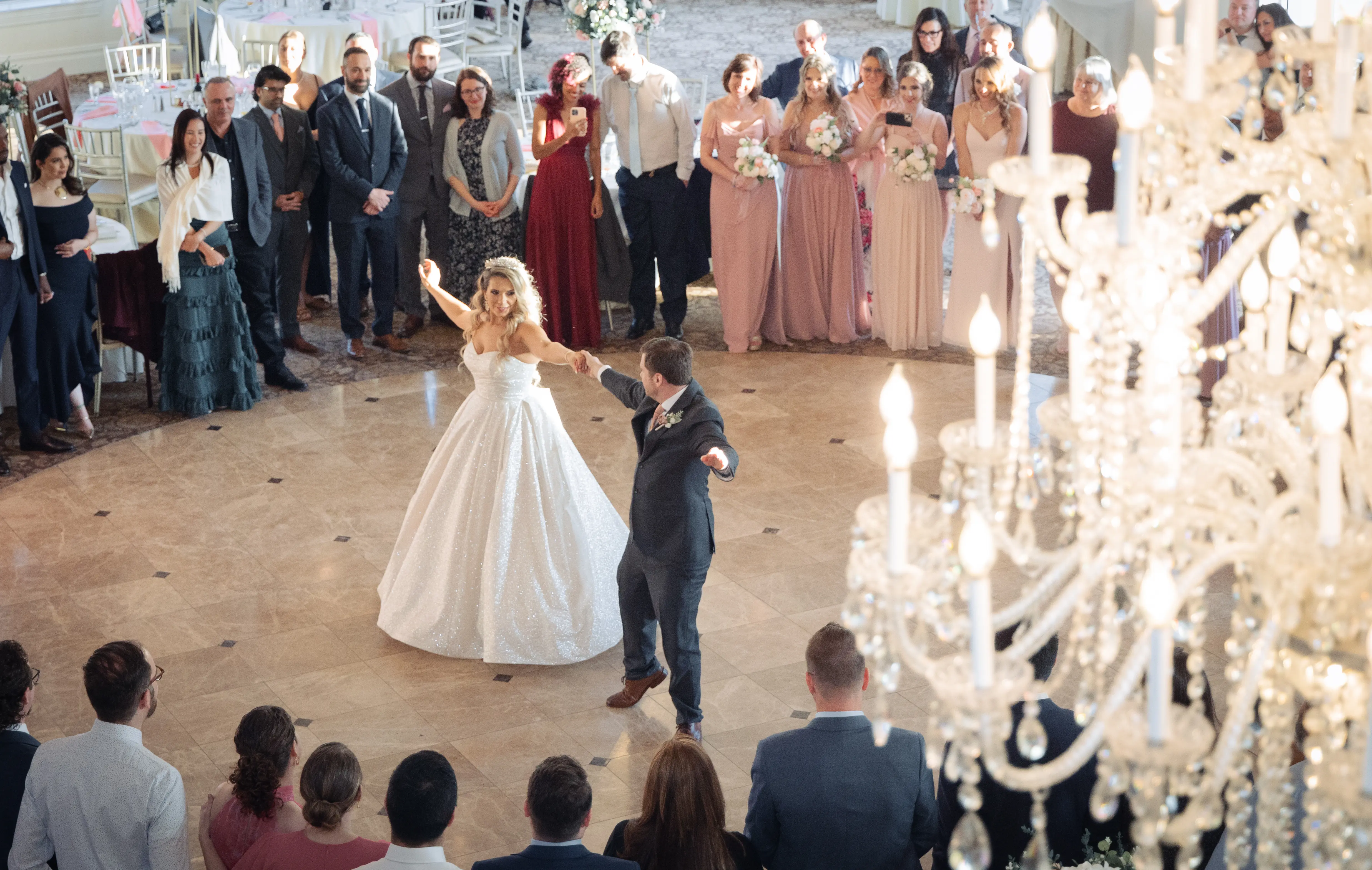 Bride wearing Anniston by Maggie Sottero and dancing with her husband