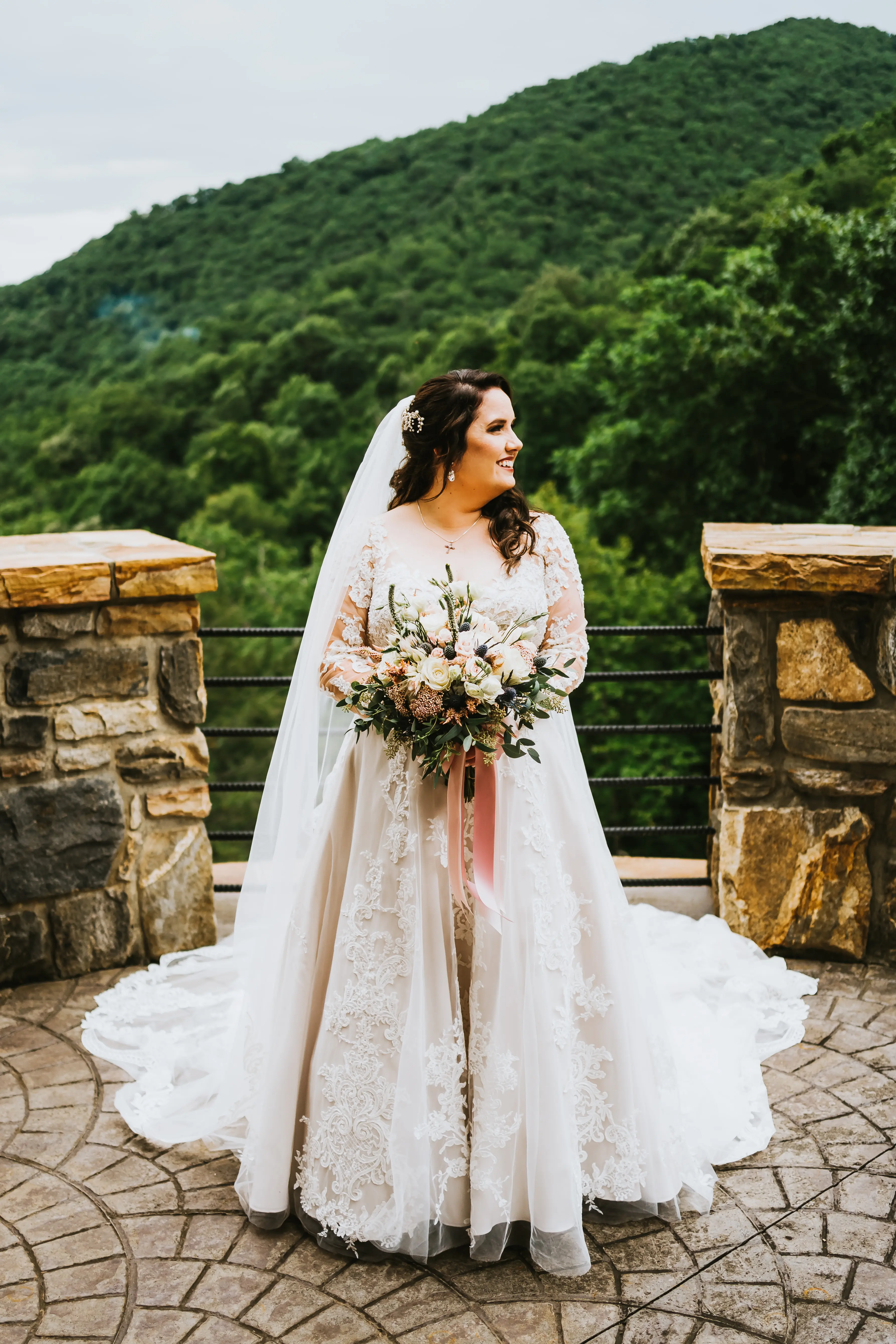 Bride Wearing Shimmery Princess Bridal Gown Called Tiffany By Maggie Sottero Hold Flower Bouquet