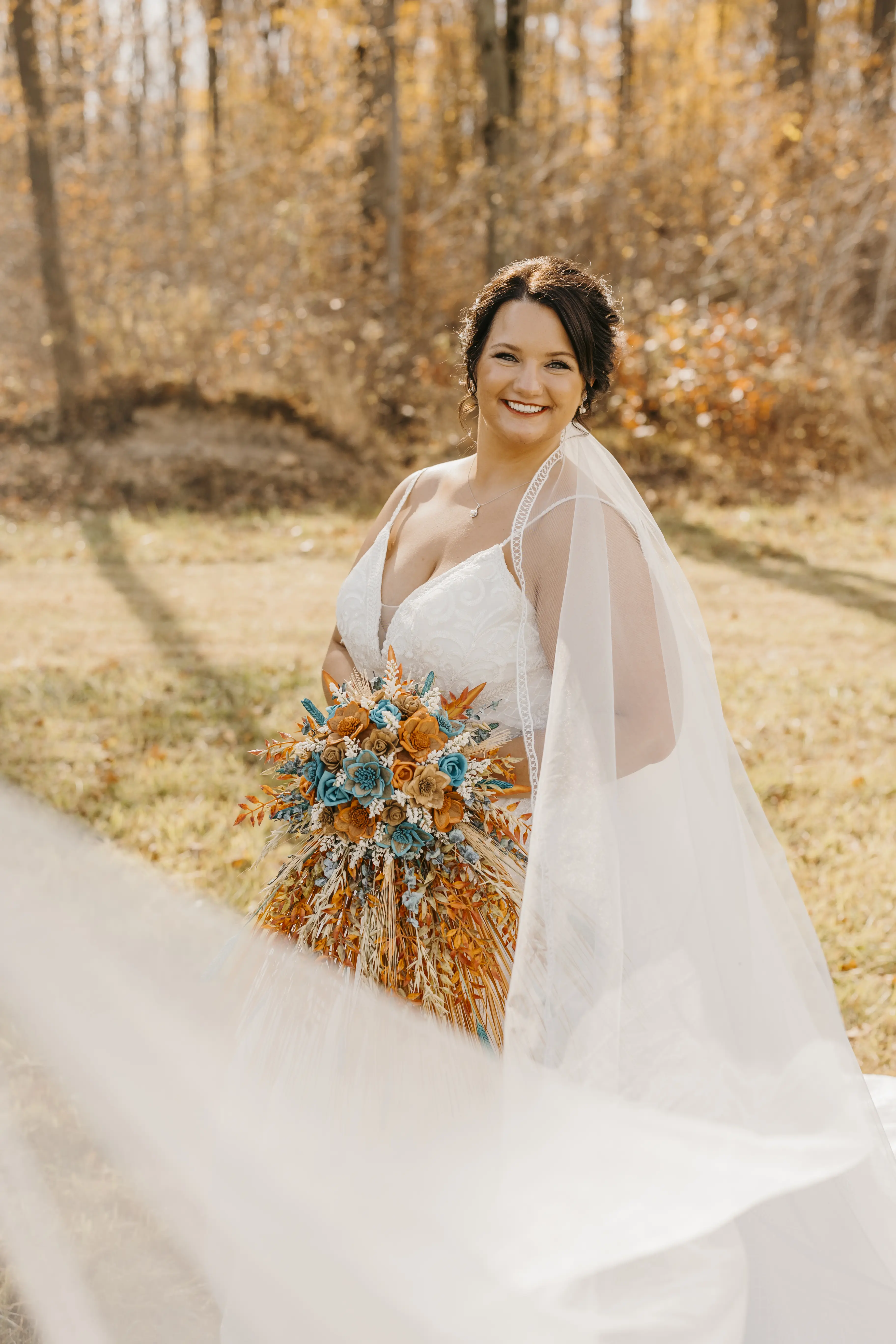 Smiling Bride in Deep V-Neckline Wedding Dress Called Roxanne by Sottero & Midgley