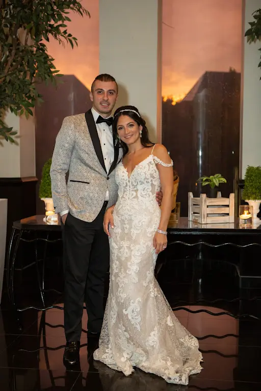 Bride Wearing Lace Sheath Wedding Dress Called Tuscany Lynette By Maggie Sottero With Groom